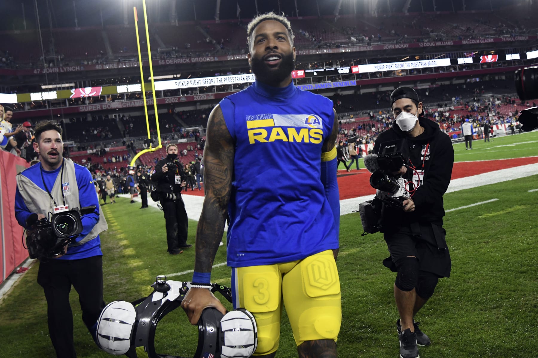 FILE - Los Angeles Rams wide receiver Odell Beckham Jr. (3) celebrates after the team defeated the Tampa Bay Buccaneers during an NFL divisional round playoff football game on Jan. 23, 2022, in Tampa, Fla. The Los Angeles Rams have not given up on re-signing Beckham, even if the injured receiver was decidedly unimpressed by their initial attempts to do so. (AP Photo/Jason Behnken, File)