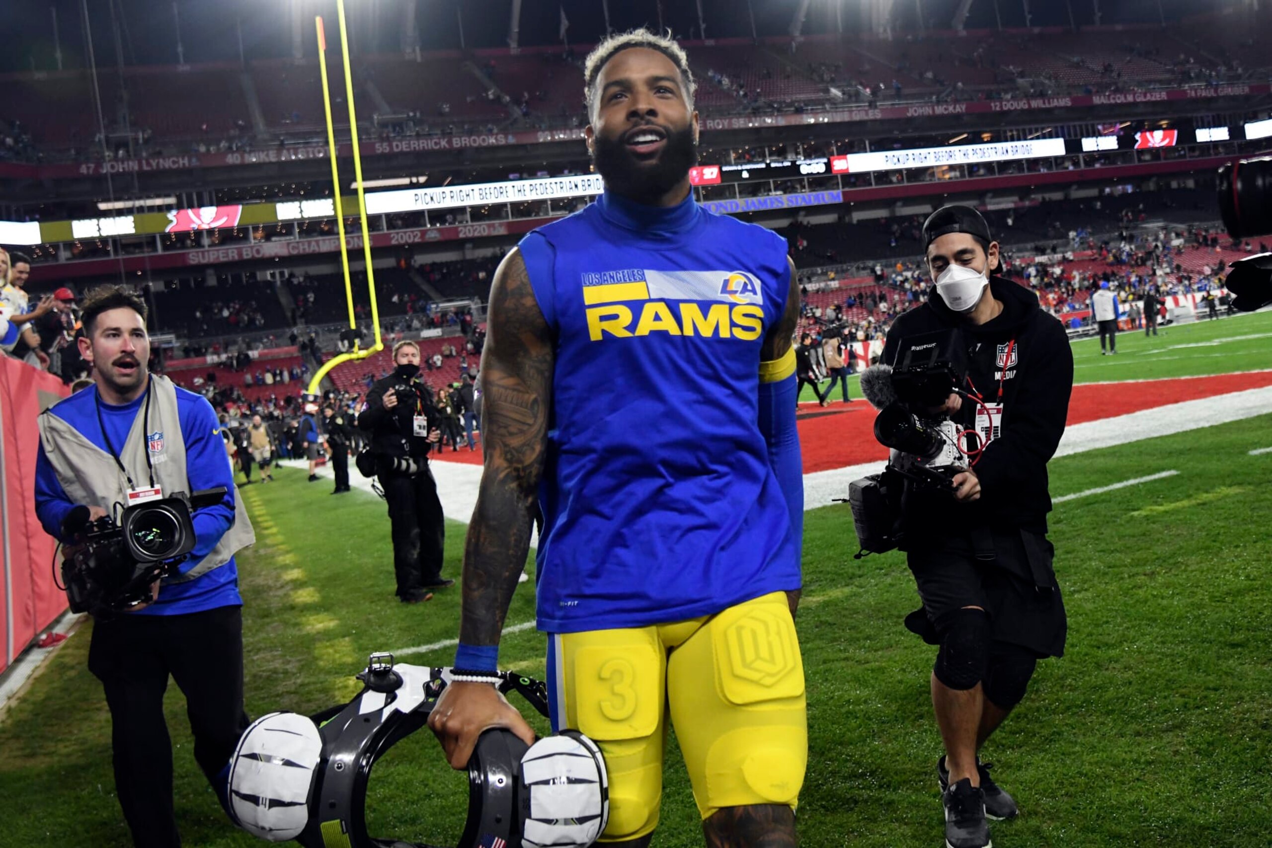 FILE - Los Angeles Rams wide receiver Odell Beckham Jr. (3) celebrates after the team defeated the Tampa Bay Buccaneers during an NFL divisional round playoff football game on Jan. 23, 2022, in Tampa, Fla. The Los Angeles Rams have not given up on re-signing Beckham, even if the injured receiver was decidedly unimpressed by their initial attempts to do so. (AP Photo/Jason Behnken, File)
