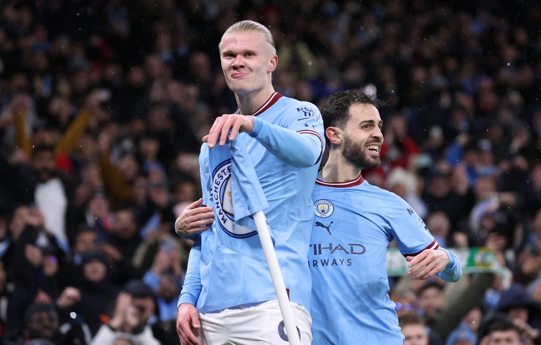 MANCHESTER, ENGLAND - MARCH 14: Erling Haaland of Manchester City celebrates with Bernardo Silva after scoring their second goal during the UEFA Champions League round of 16 leg two match between Manchester City and RB Leipzig at Etihad Stadium on March 14, 2023 in Manchester, England. (Photo by Alex Livesey - Danehouse/Getty Images)
