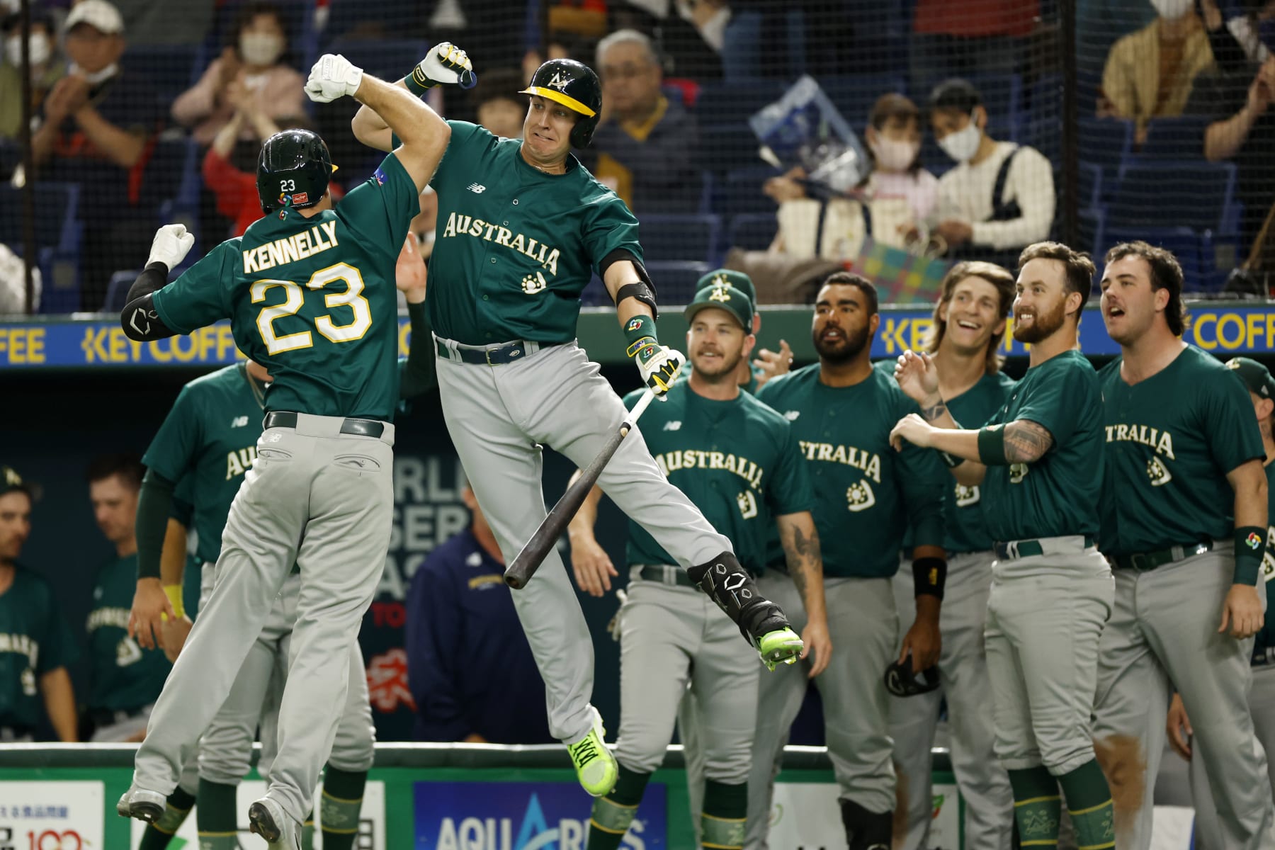 BUNKYO CITY, JAPAN - MARCH 09: Tim Kennelly #23 of Team Australia celebrates with Robbie Glendinning #6 after a home run during the game between the Team Australia and the Team Korea at Tokyo Dome on Thursday, March 9, 2023 in Bunkyo City, Japan. (Photo by Yuki Taguchi/MLB Photos via Getty Images)