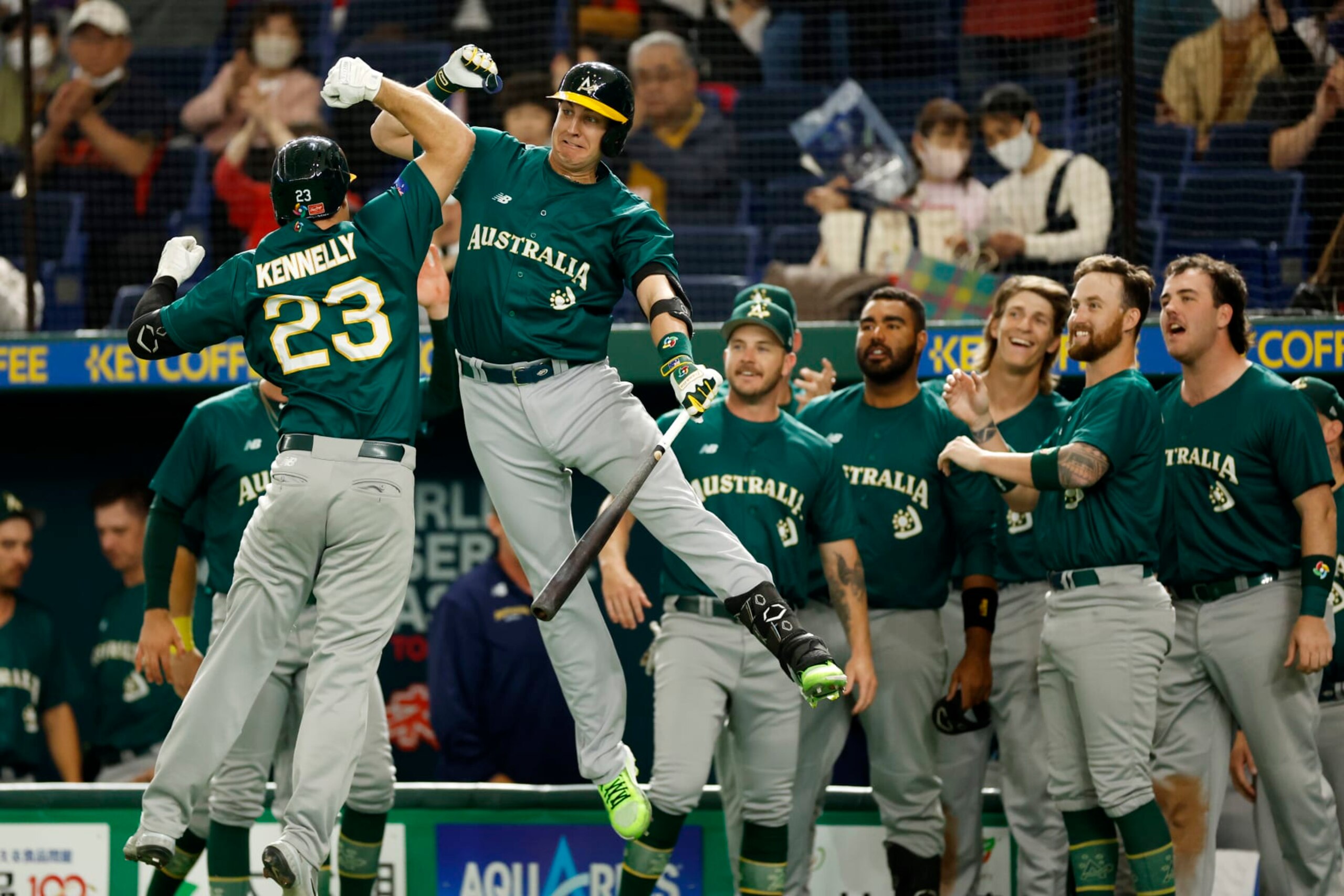 BUNKYO CITY, JAPAN - MARCH 09: Tim Kennelly #23 of Team Australia celebrates with Robbie Glendinning #6 after a home run during the game between the Team Australia and the Team Korea at Tokyo Dome on Thursday, March 9, 2023 in Bunkyo City, Japan. (Photo by Yuki Taguchi/MLB Photos via Getty Images)