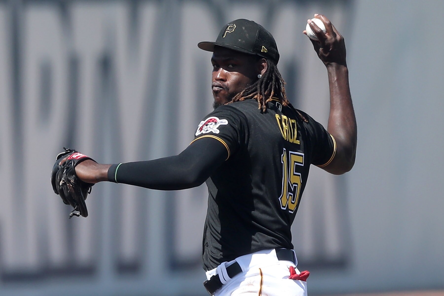 BRADENTON, FL - FEBRUARY 27: Pittsburgh Pirates Shortstop Oneil Cruz (15) throws the ball over to first base during the spring training game between the Philadelphia Phillies and the Pittsburgh Pirates on February 27, 2023, at LECOM Park in Bradenton, FL. (Photo by Cliff Welch/Icon Sportswire via Getty Images)