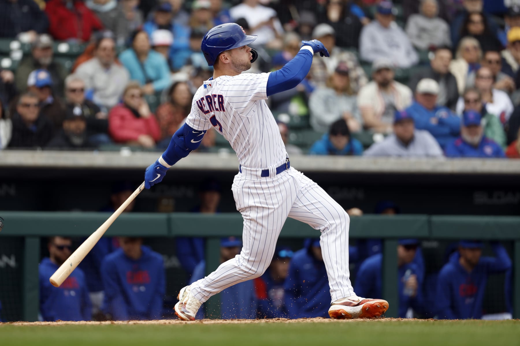 MESA, ARIZONA - MARCH 01: Nico Hoerner #2 of the Chicago Cubs hits a ground ball during the fourth inning of a spring training game against the Seattle Mariners at Sloan Park on March 01, 2023 in Mesa, Arizona. (Photo by Chris Coduto/Getty Images)