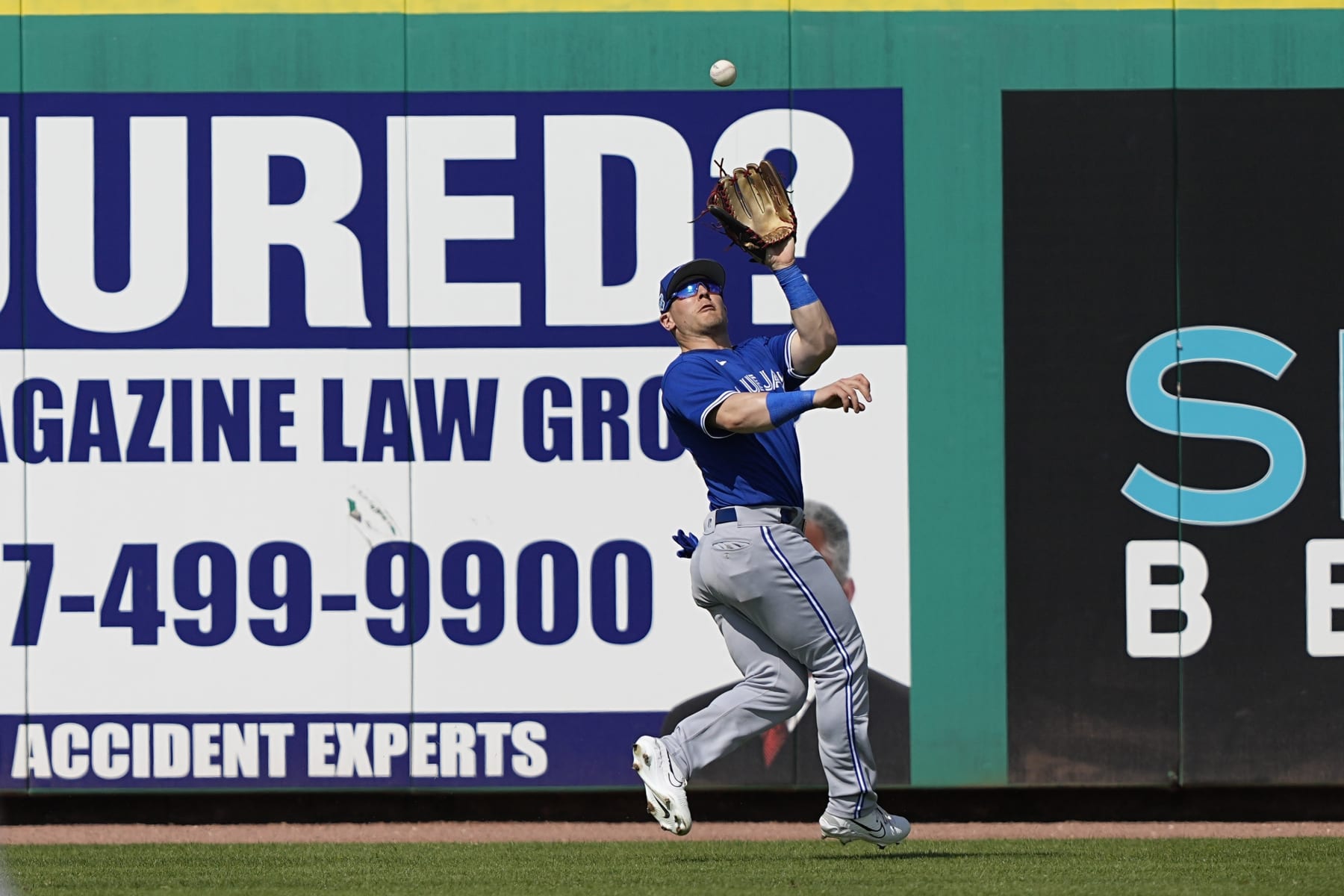 Toronto Blue Jays outfielder Daulton Varsho catches a fly ball by Philadelphia Phillies' Bryson Stott during the fourth inning of a spring training baseball game Tuesday, Feb. 28, 2023, in Clearwater, Fla. (AP Photo/David J. Phillip)