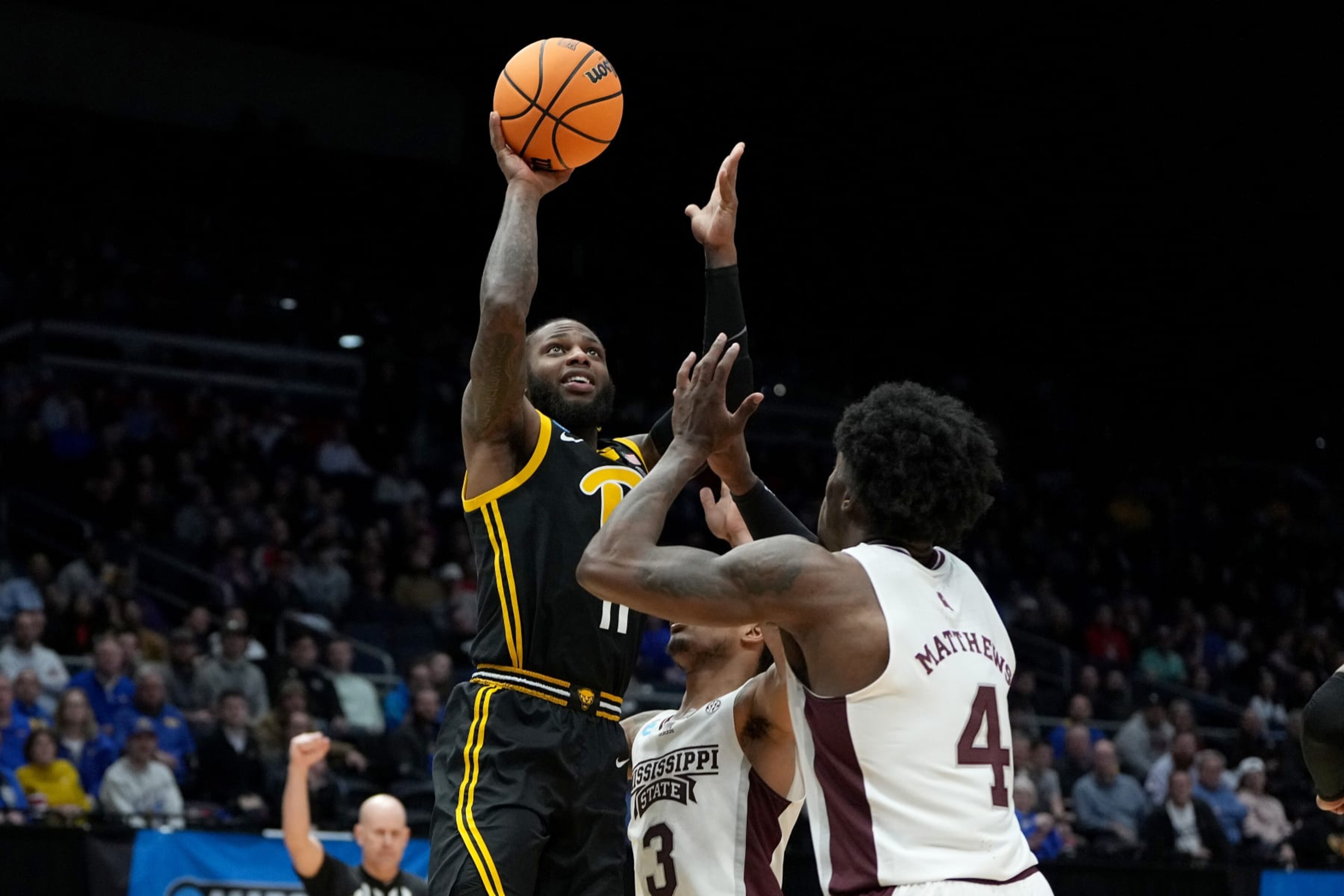 DAYTON, OHIO - MARCH 14: Jamarius Burton #11 of the Pittsburgh Panthers shoots the ball against Shakeel Moore #3 and Cameron Matthews #4 of the Mississippi State Bulldogs during the second half in the First Four game of the NCAA Men's Basketball Tournament at University of Dayton Arena on March 14, 2023 in Dayton, Ohio. (Photo by Dylan Buell/Getty Images) DAYTON, OHIO - MARCH 14: Jamarius Burton #11 of the Pittsburgh Panthers shoots the ball against Shakeel Moore #3 and Cameron Matthews #4 of the Mississippi State Bulldogs during the second half in the First Four game of the NCAA Men's Basketball Tournament at University of Dayton Arena on March 14, 2023 in Dayton, Ohio. (Photo by Dylan Buell/Getty Images)
