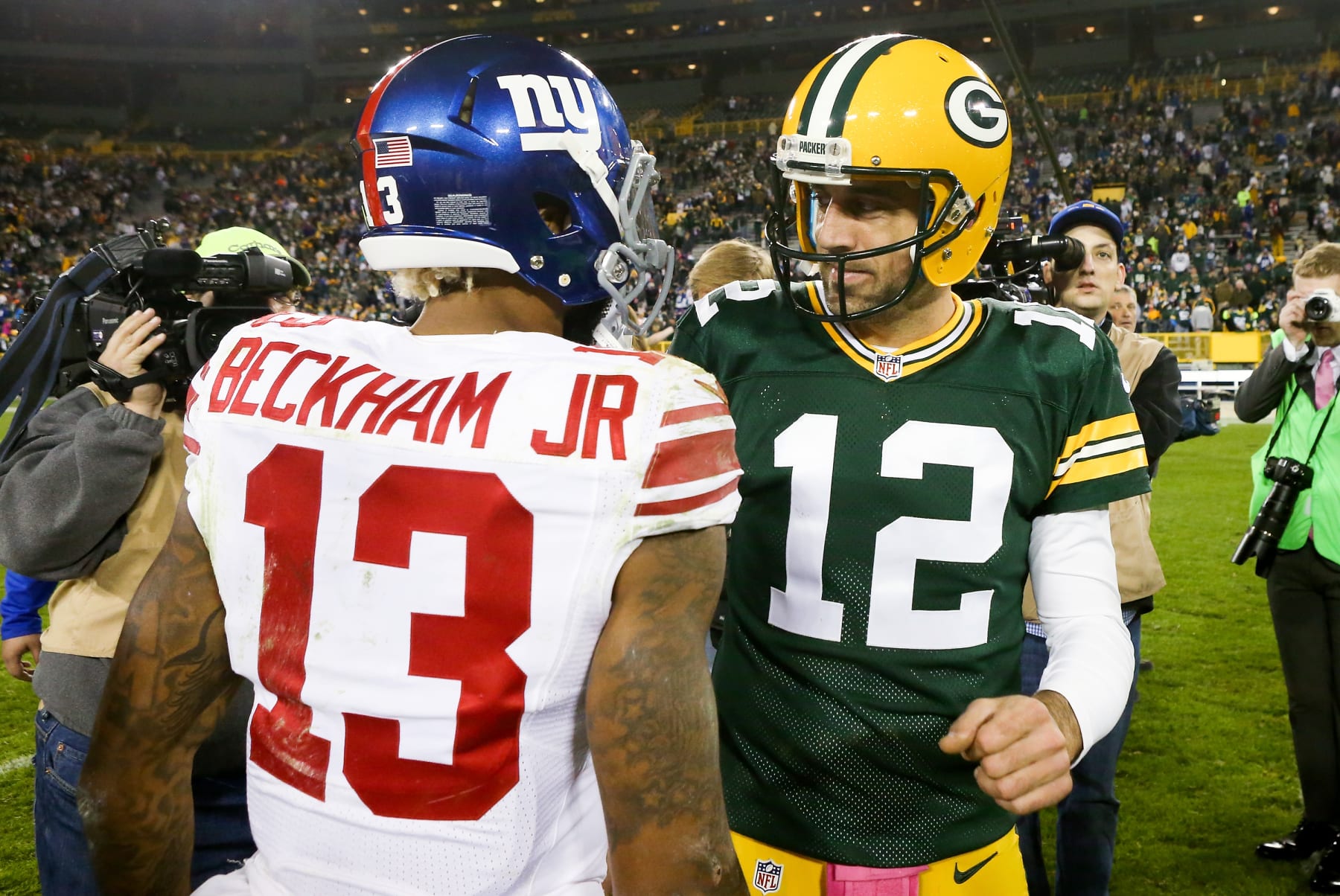 GREEN BAY, WI - OCTOBER 09:  Aaron Rodgers #12 of the Green Bay Packers meets with Odell Beckham Jr. #13 of the New York Giants after the game at Lambeau Field on October 9, 2016 in Green Bay, Wisconsin. (Photo by Dylan Buell/Getty Images)