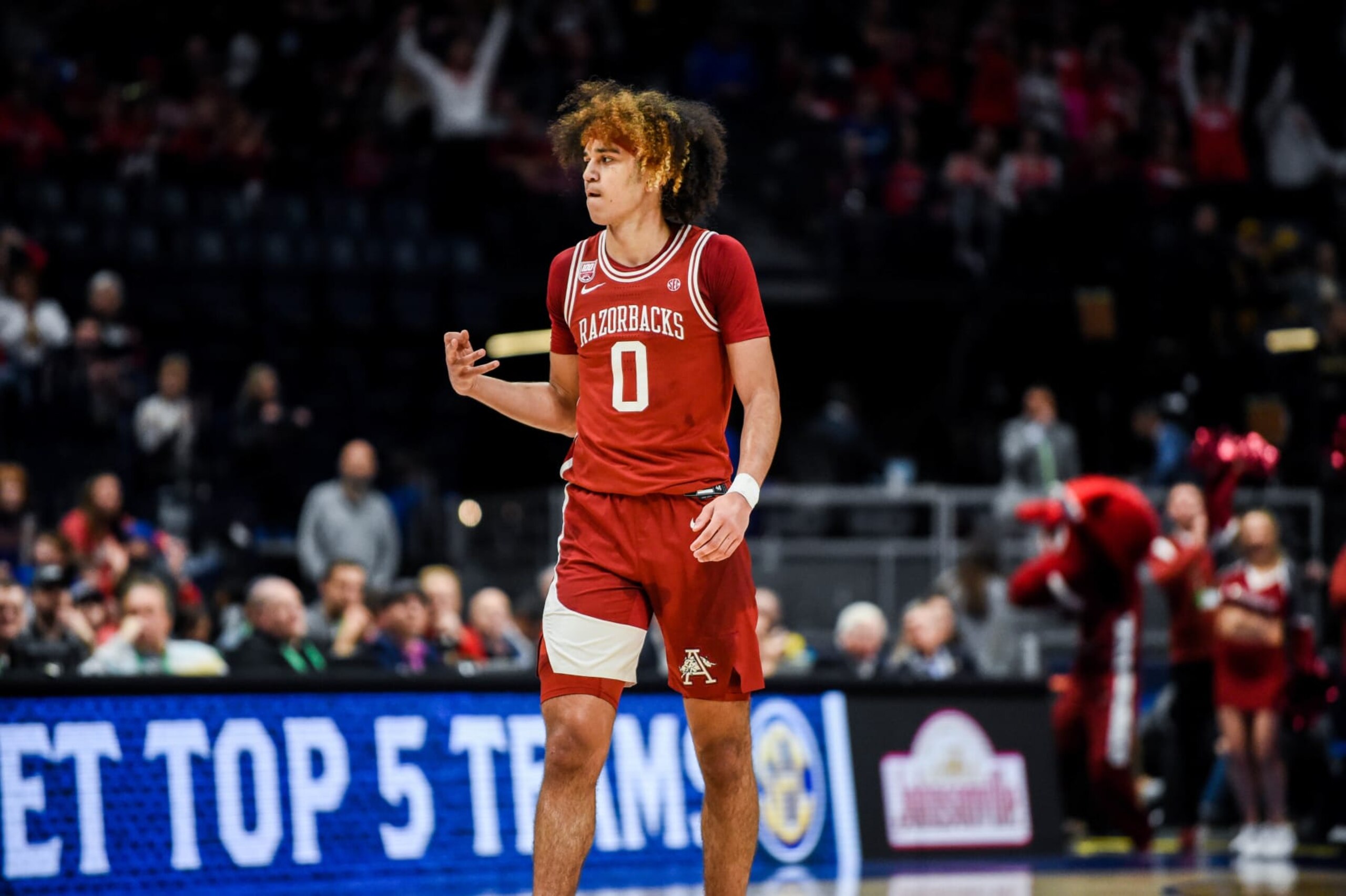 NASHVILLE, TENNESSEE - MARCH 10: Anthony Black of #0 of the Arkansas Razorbacks celebrates a three pointer against the Texas A&M Aggies in the first half during the quarterfinals of the 2023 SEC Men's Basketball Tournament at Bridgestone Arena on March 10, 2023 in Nashville, Tennessee. (Photo by Carly Mackler/Getty Images)