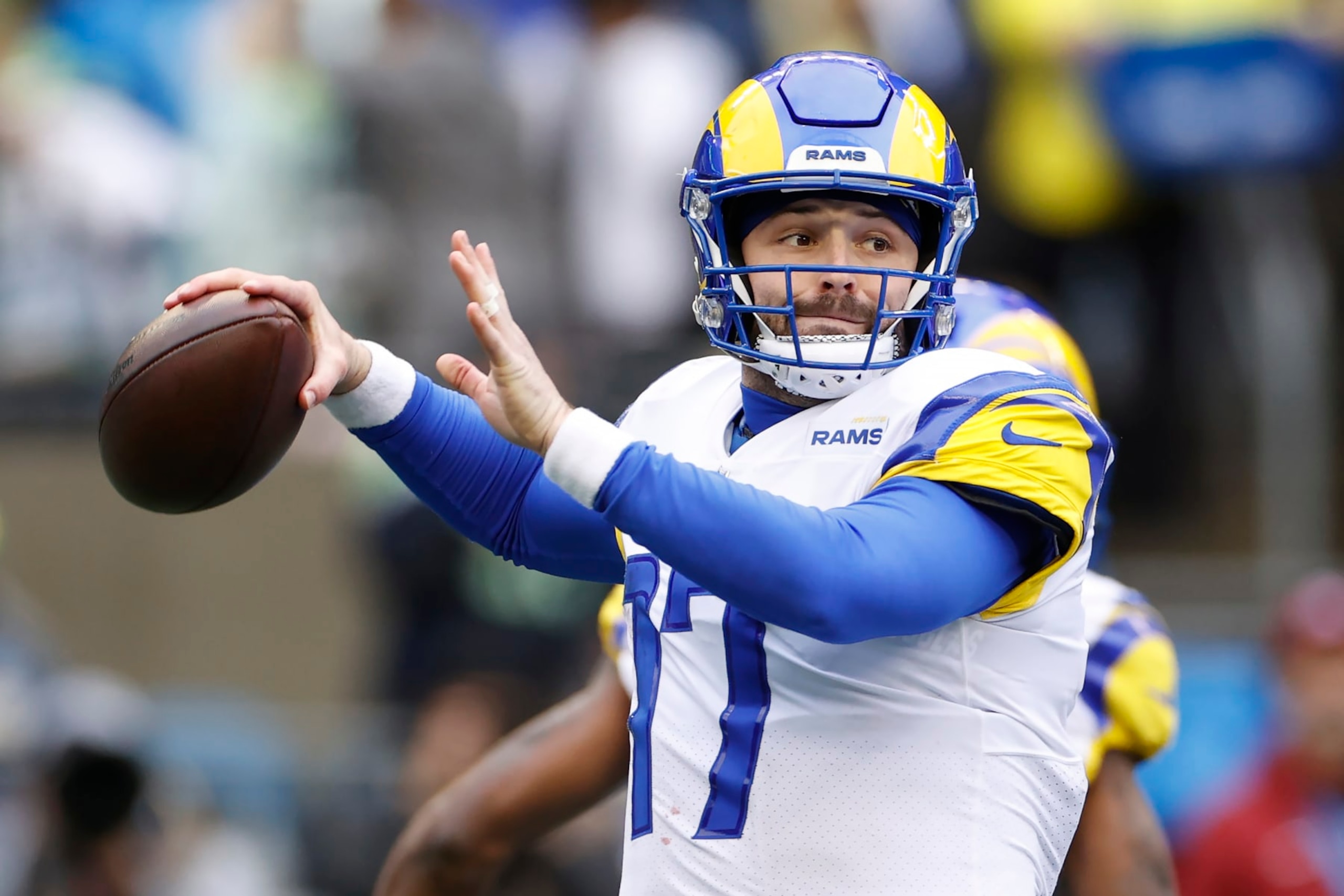 SEATTLE, WASHINGTON - JANUARY 08: Baker Mayfield #17 of the Los Angeles Rams throws the ball during the first half against the Seattle Seahawks at Lumen Field on January 08, 2023 in Seattle, Washington. (Photo by Steph Chambers/Getty Images)