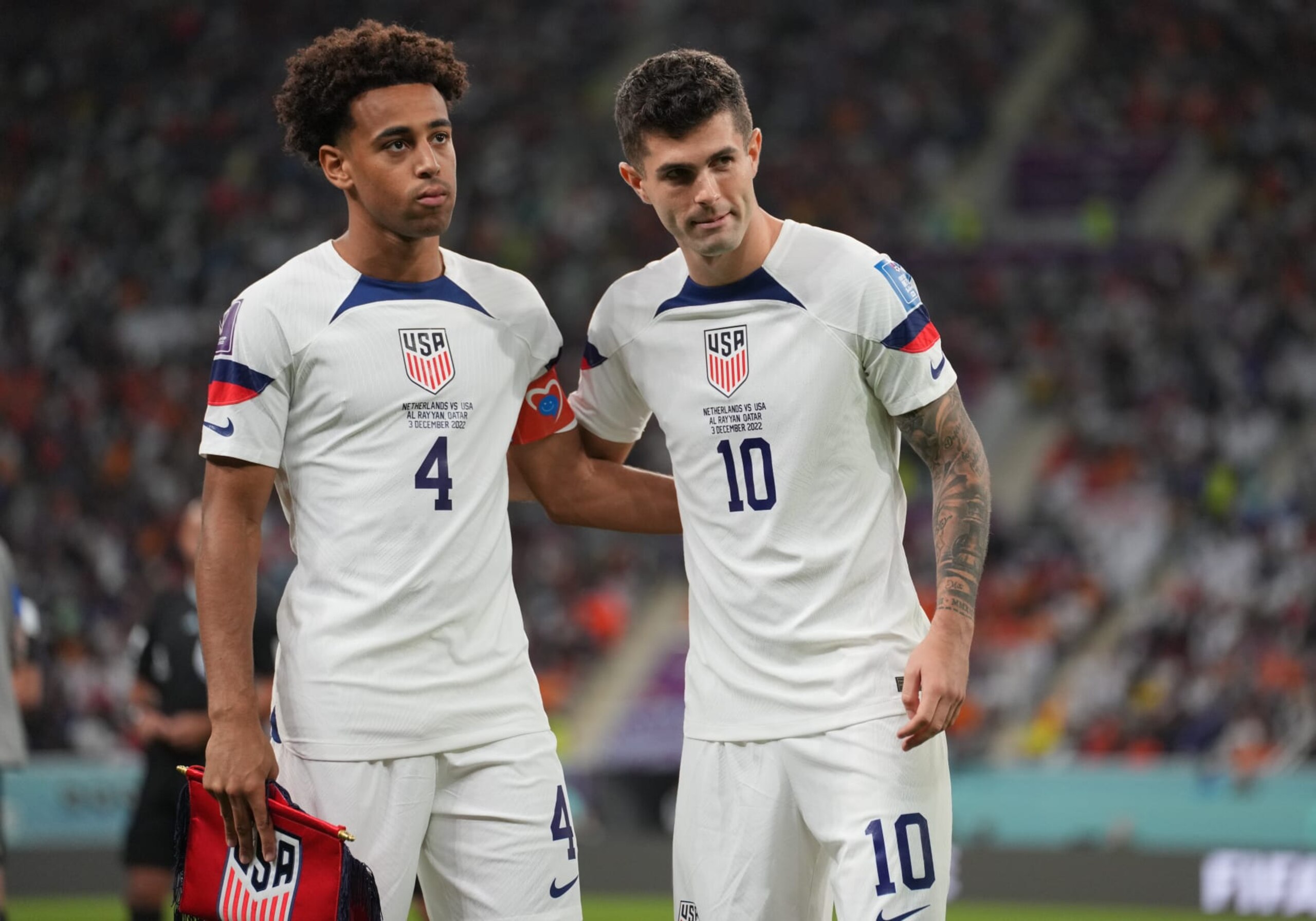 DOHA, QATAR - DECEMBER 3: Tyler Adams #4 and Christian Pulisic #10  of the United States during a FIFA World Cup Qatar 2022 Round of 16 match between Netherlands and USMNT at Khalifa International Stadium on December 3, 2022 in Doha, Qatar. (Photo by John Todd/ISI Photos/Getty Images)