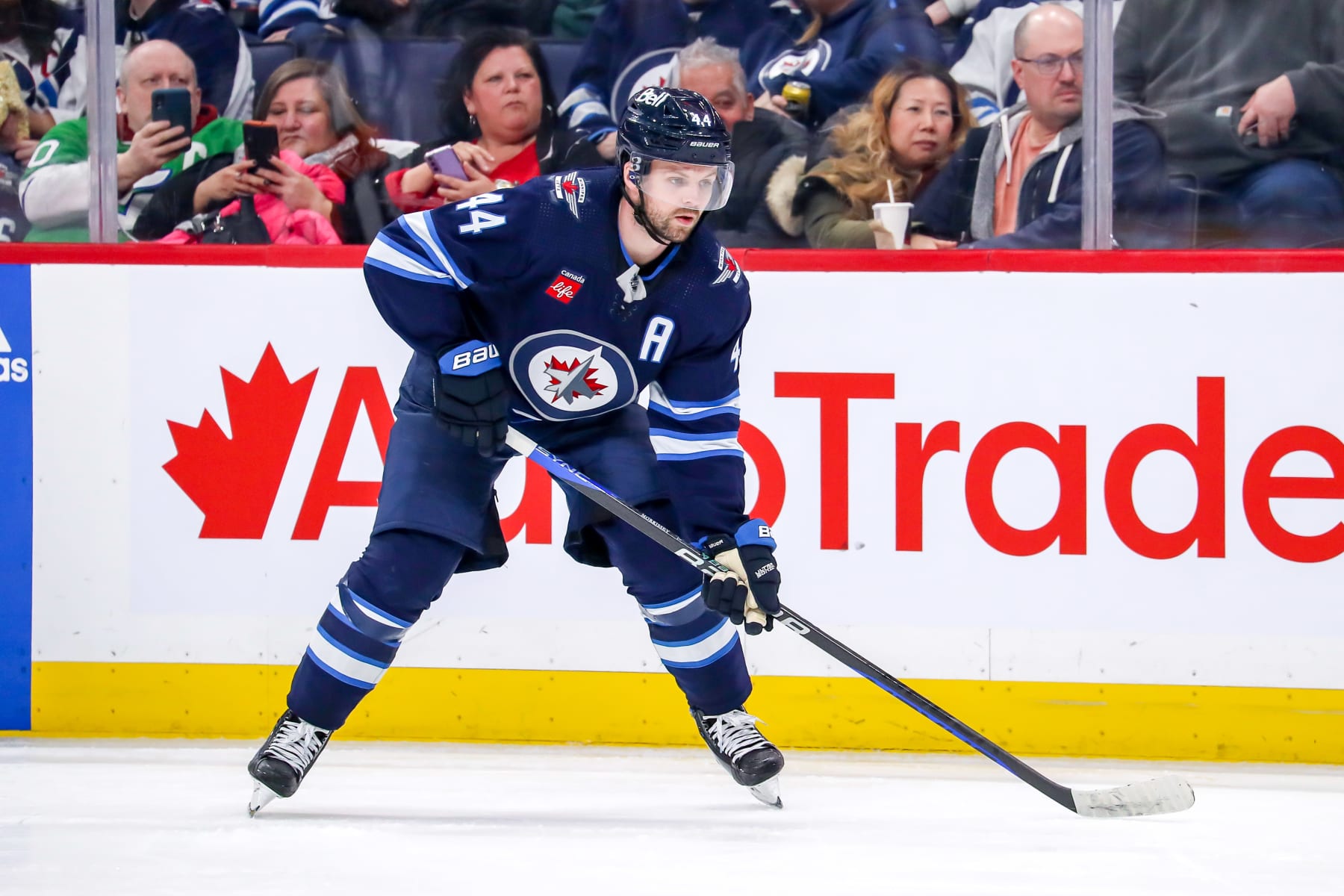 WINNIPEG, CANADA - FEBRUARY 14: Josh Morrissey #44 of the Winnipeg Jets gets set during a third period face-off against the Seattle Kraken at the Canada Life Centre on February 14, 2023 in Winnipeg, Manitoba, Canada. The Jets defeated the Kraken 3-2 in the shootout. (Photo by Darcy Finley/NHLI via Getty Images)