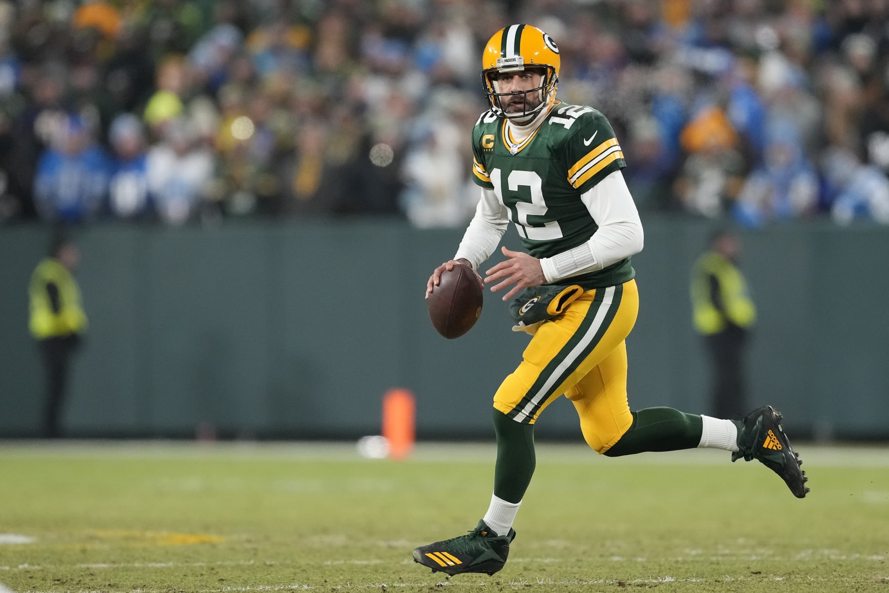 GREEN BAY, WISCONSIN - JANUARY 08: Aaron Rodgers #12 of the Green Bay Packers looks to throw a pass against the Detroit Lions in the first half at Lambeau Field on January 08, 2023 in Green Bay, Wisconsin. (Photo by Patrick McDermott/Getty Images)