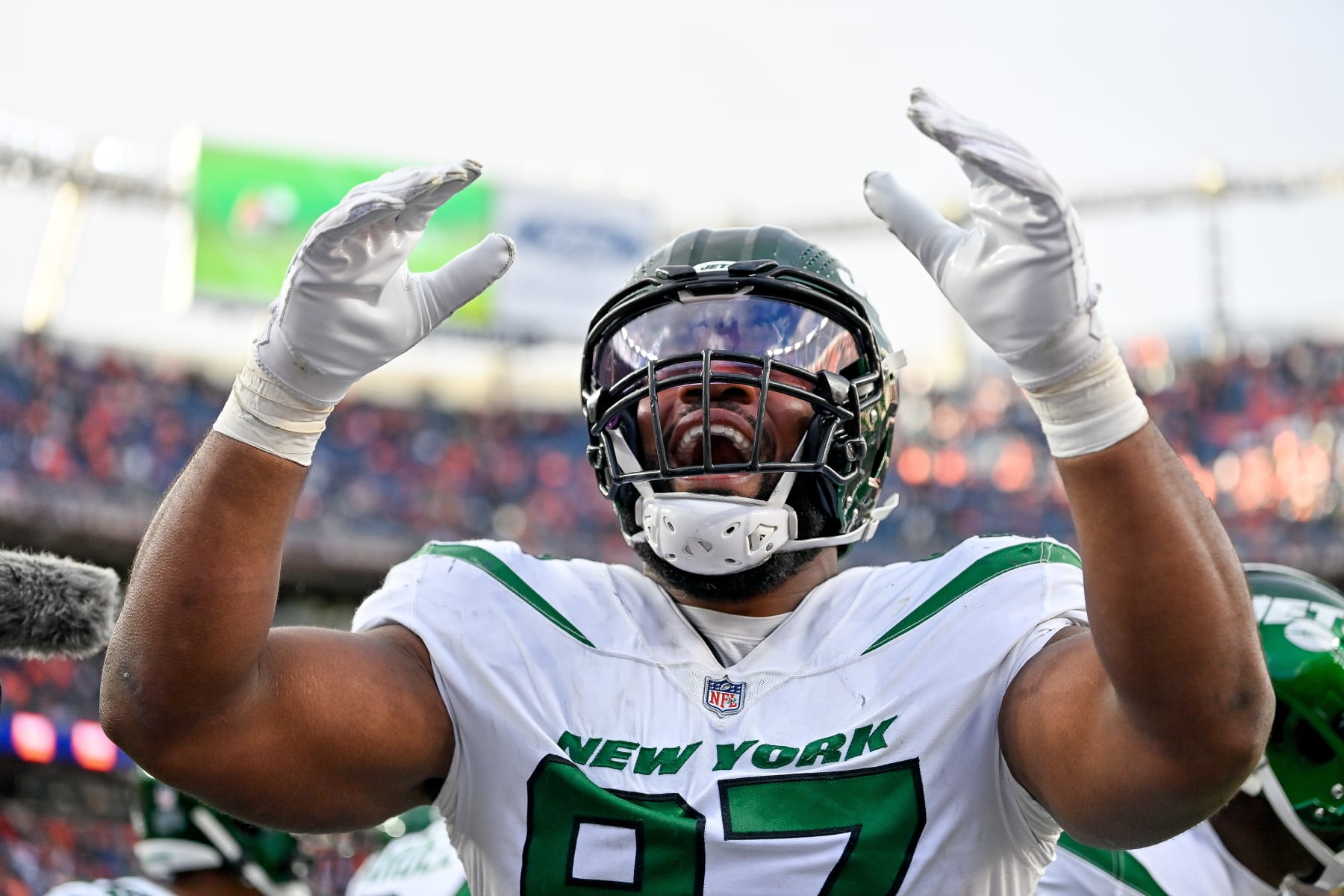 DENVER, COLORADO - OCTOBER 23:  Defensive tackle Nathan Shepherd #97 of the New York Jets celebrates after a play against the Denver Broncos in the fourth quarter of a game at Empower Field at Mile High on October 23, 2022 in Denver, Colorado. (Photo by Dustin Bradford/Getty Images)