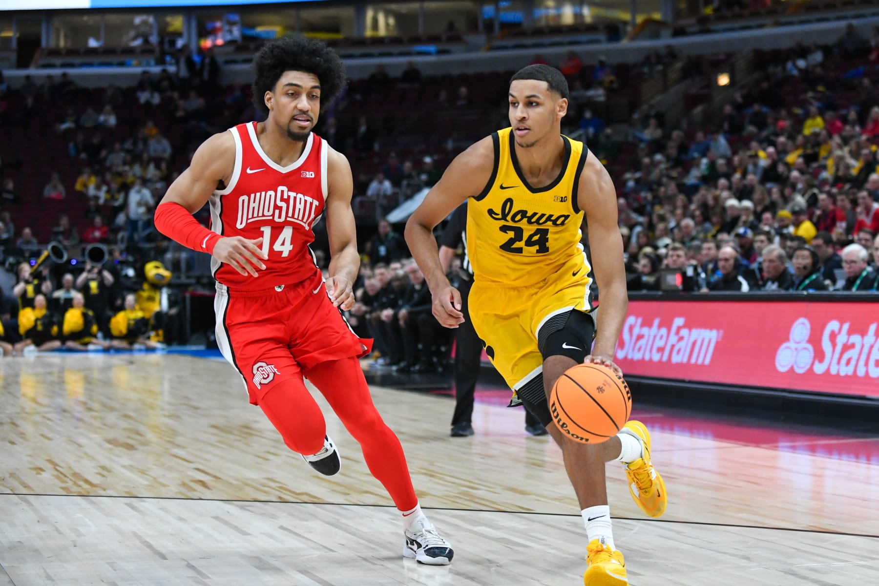 CHICAGO, ILLINOIS - MARCH 09: Kris Murray #24 of the Iowa Hawkeyes drives to the basket against Justice Sueing #14 of the Ohio State Buckeyes during the first half of a Big Ten Men's Basketball Tournament Second Round game at United Center on March 09, 2023 in Chicago, Illinois. (Photo by Aaron J. Thornton/Getty Images)