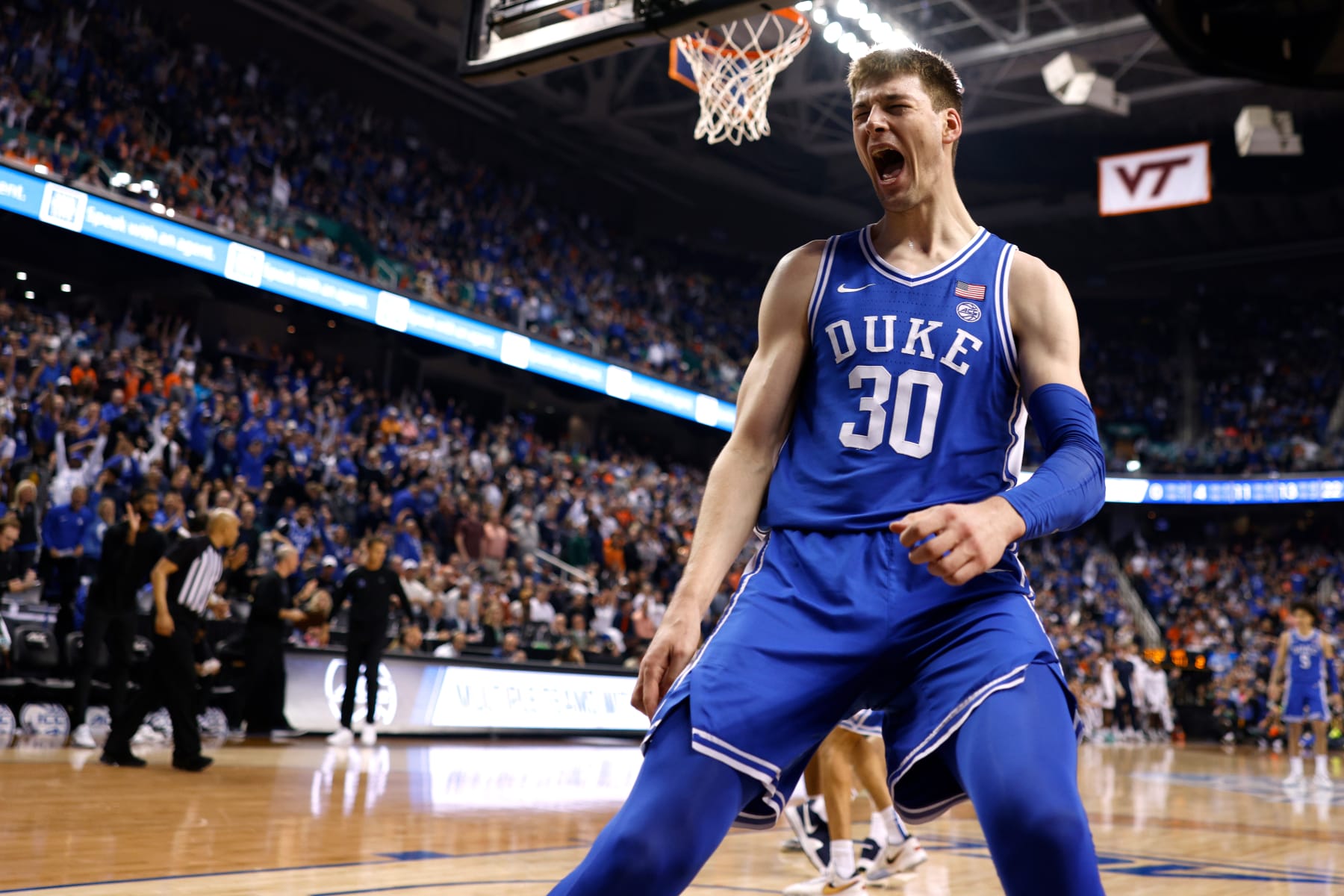 GREENSBORO, NC - MARCH 11: Kyle Filipowski #30 of the Duke Blue Devils reacts following a dunk against the Virginia Cavaliers during the second half of the ACC Basketball Tournament Championship game at Greensboro Coliseum on March 11, 2023 in Greensboro, North Carolina. (Photo by Lance King/Getty Images)
