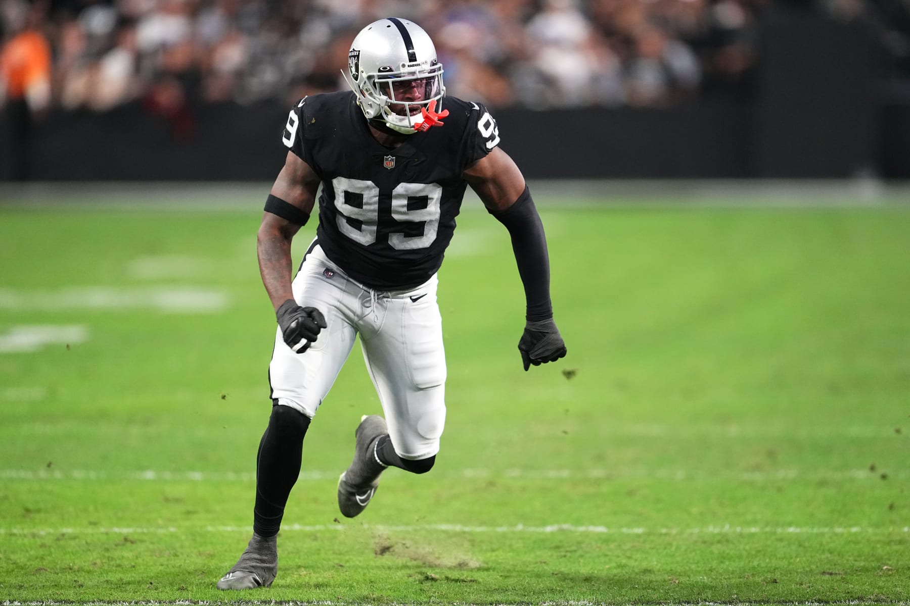 LAS VEGAS, NEVADA - DECEMBER 04: Defensive end Clelin Ferrell #99 of the Las Vegas Raiders rushes the quarterback in the second half of a game against the Los Angeles Chargers at Allegiant Stadium on December 04, 2022 in Las Vegas, Nevada. (Photo by Chris Unger/Getty Images)
