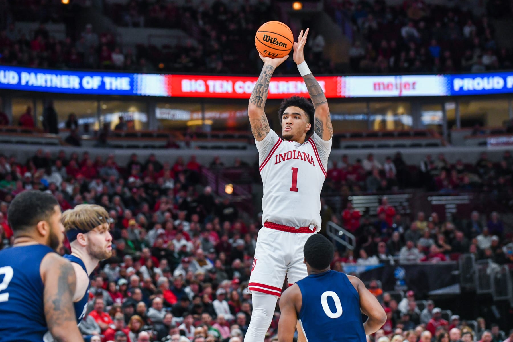 CHICAGO, ILLINOIS - MARCH 11: Jalen Hood-Schifino #1 of the Indiana Hoosiers attempts a shot over Kanye Clary #0 of the Penn State Nittany Lions during the first half of a Big Ten Men's Basketball Tournament Semifinals game at United Center on March 11, 2023 in Chicago, Illinois. (Photo by Aaron J. Thornton/Getty Images)