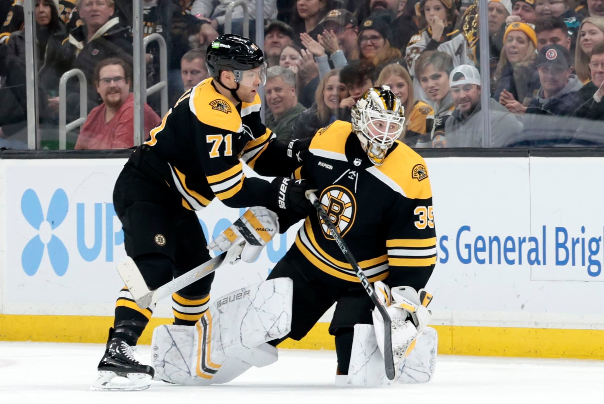 Bruins left wing Taylor Hall (71) and goalie Linus Ullmark (35) 