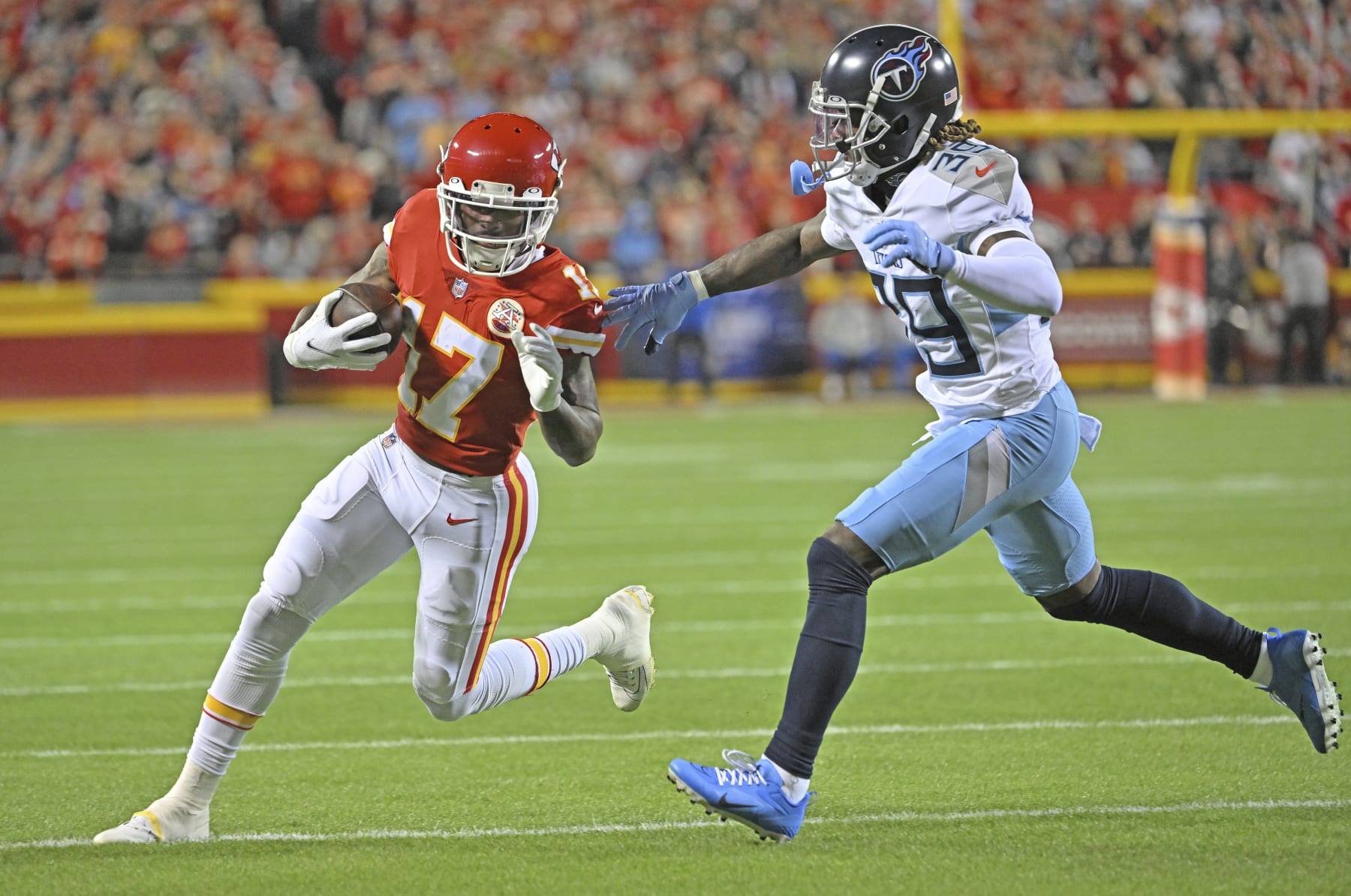 Kansas City Chiefs wide receiver Mecole Hardman (17) rduns with the ball against Tennessee Titans cornerback Terrance Mitchell (39) during an NFL football game Sunday, Nov. 6, 2022, in Kansas City, Mo. (AP Photo/Peter Aiken)