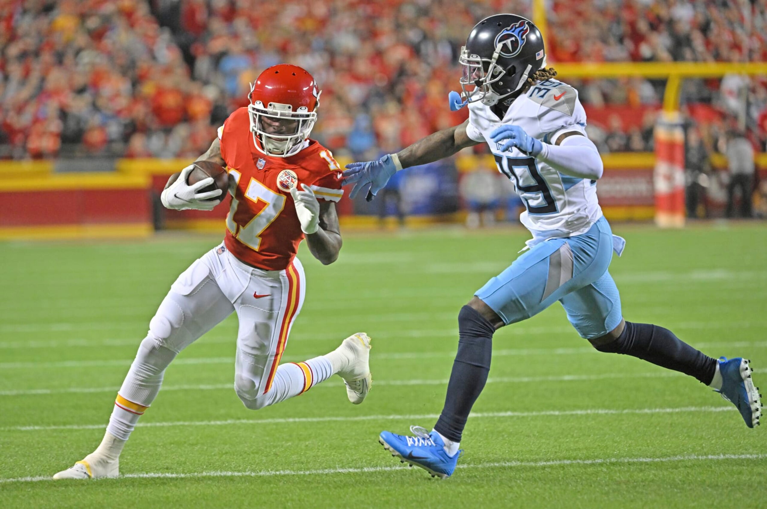 Kansas City Chiefs wide receiver Mecole Hardman (17) rduns with the ball against Tennessee Titans cornerback Terrance Mitchell (39) during an NFL football game Sunday, Nov. 6, 2022, in Kansas City, Mo. (AP Photo/Peter Aiken)