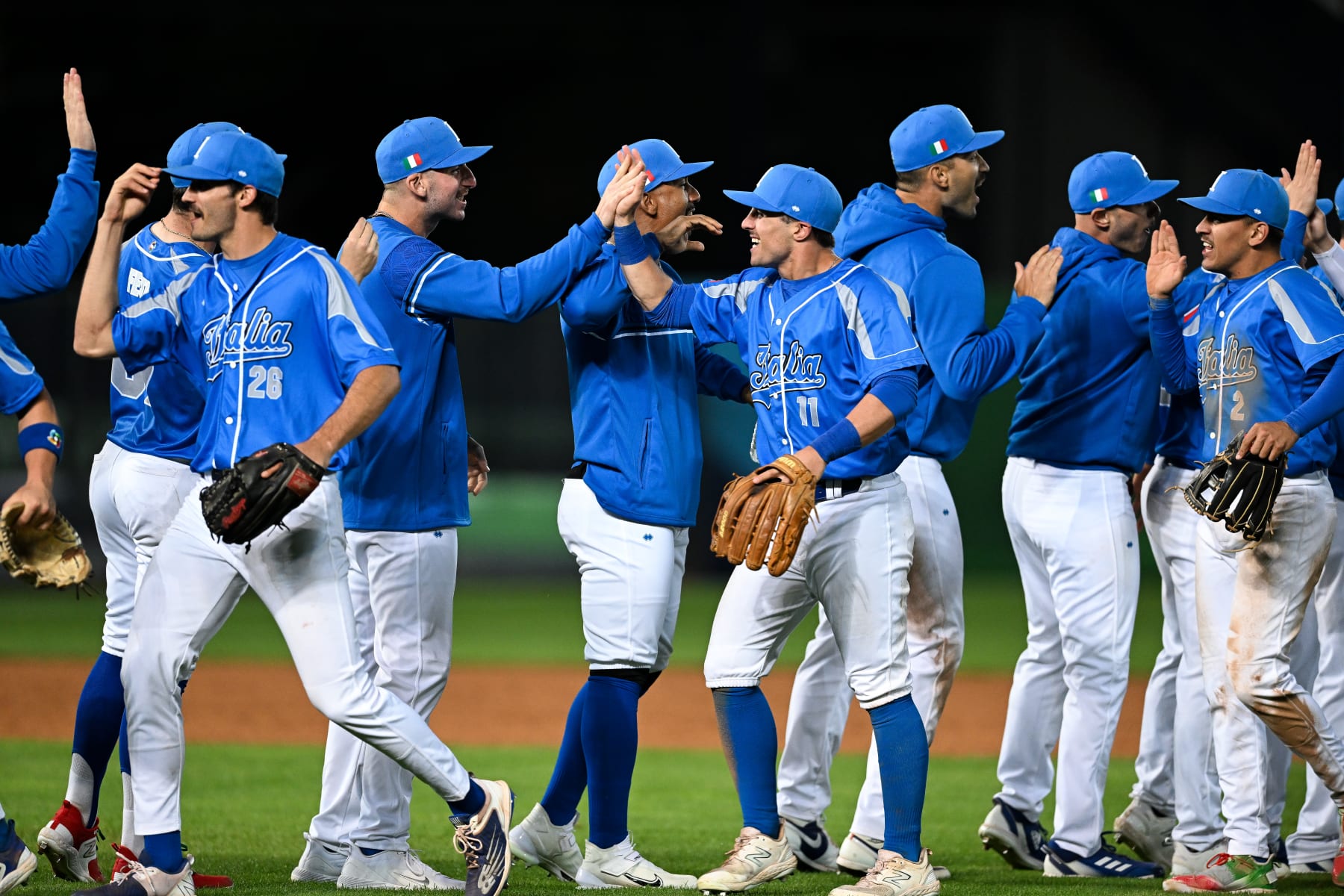 TAICHUNG, TAIWAN - MARCH 12: Ben DeLuzio #26, Sal Frelick #11, Nicky Lopez #2 of Team Italy celebrate after winning the World Baseball Classic Pool A game between Netherlands and Italy at Taichung Intercontinental Baseball Stadium on March 12, 2023 in Taichung, Taiwan. (Photo by Gene Wang/Getty Images)