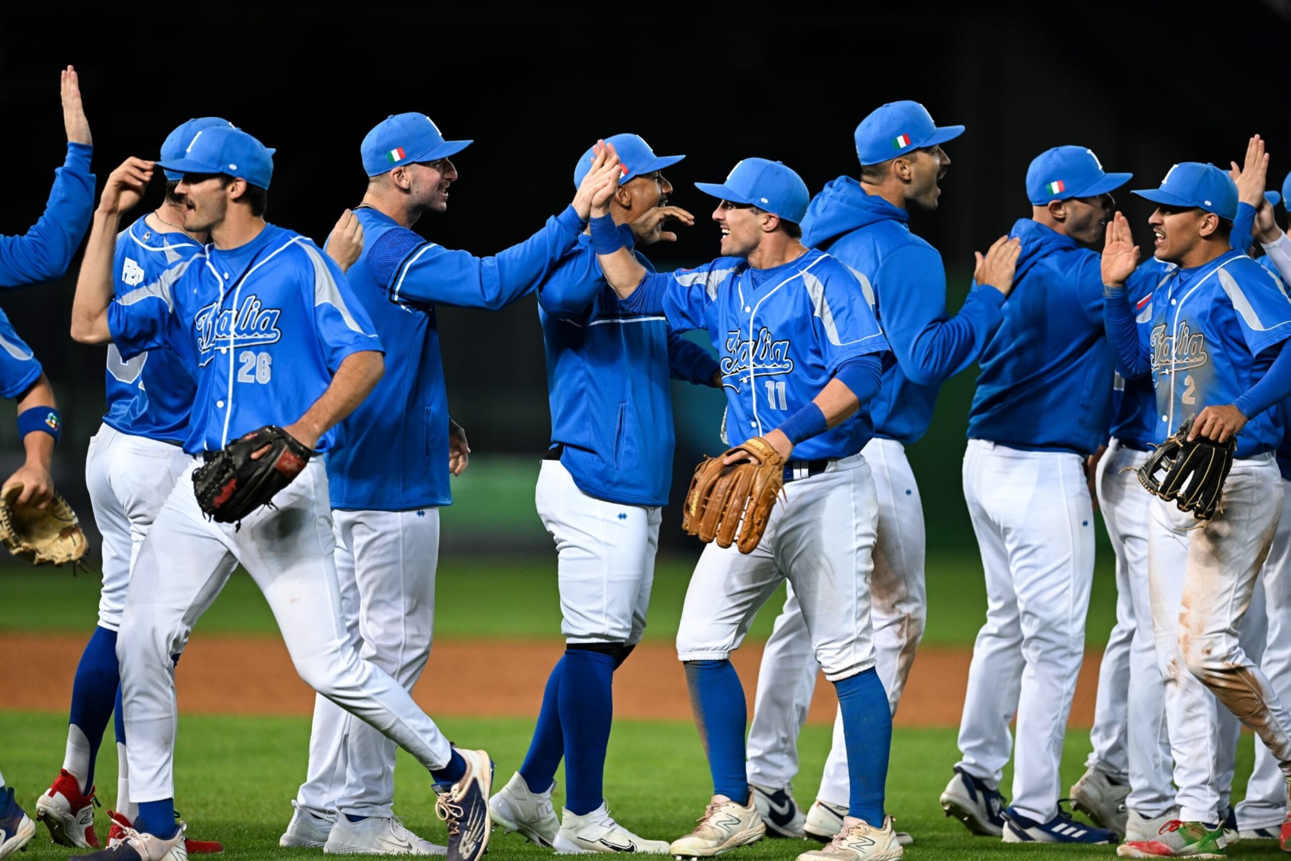 TAICHUNG, TAIWAN - MARCH 12: Ben DeLuzio #26, Sal Frelick #11, Nicky Lopez #2 of Team Italy celebrate after winning the World Baseball Classic Pool A game between Netherlands and Italy at Taichung Intercontinental Baseball Stadium on March 12, 2023 in Taichung, Taiwan. (Photo by Gene Wang/Getty Images)
