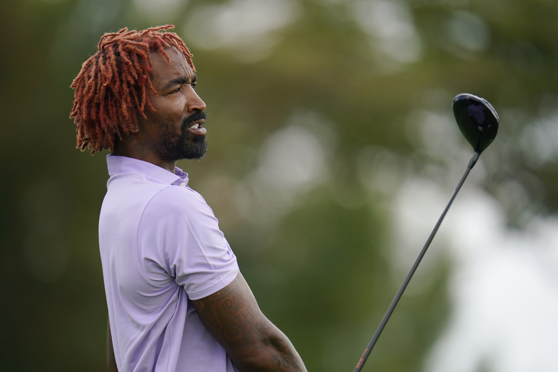 Former NBA basketball player J.R. Smith watches his tee shot on the 14th hole during the ProAm at the BMW Championship golf tournament at Wilmington Country Club, Wednesday, Aug. 17, 2022, in Wilmington, Del. The BMW Championship tournament begins on Thursday. (AP Photo/Julio Cortez)