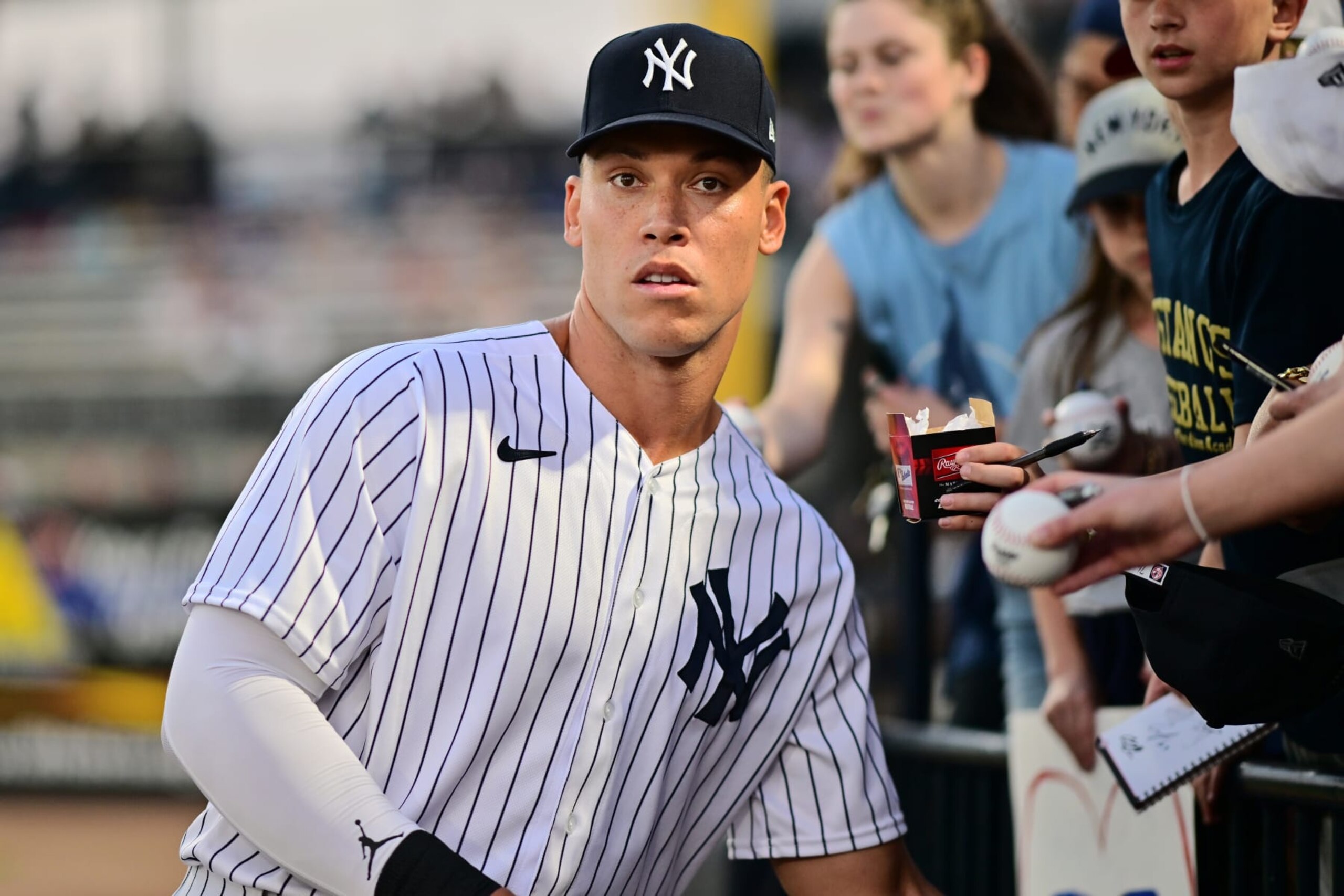 TAMPA, FLORIDA - MARCH 06: Aaron Judge #99 of the New York Yankees signs autographs prior to a Grapefruit League Spring Training game against the Pittsburgh Pirates at George M. Steinbrenner Field on March 06, 2023 in Tampa, Florida. (Photo by Julio Aguilar/Getty Images)