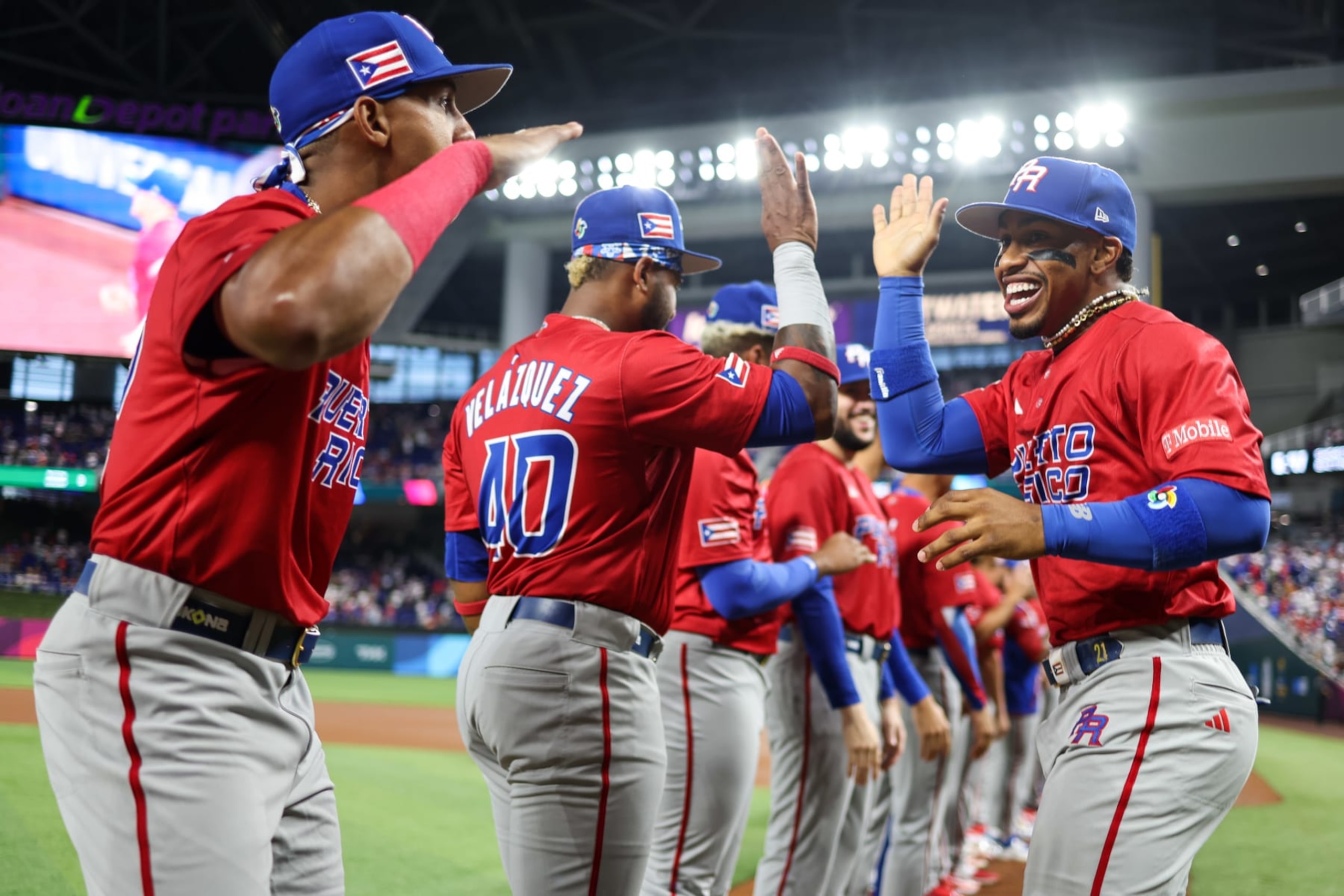 MIAMI, FL - MARCH 15:   Francisco Lindor #12 of Team Dominican Republic high-fives teammates on the field prior to Game 10 of Pool D between Team Puerto Rico and Team Dominican Republic at loanDepot Park on Wednesday, March 15, 2023 in Miami, Florida. (Photo by Rob Tringali/WBCI/MLB Photos via Getty Images)