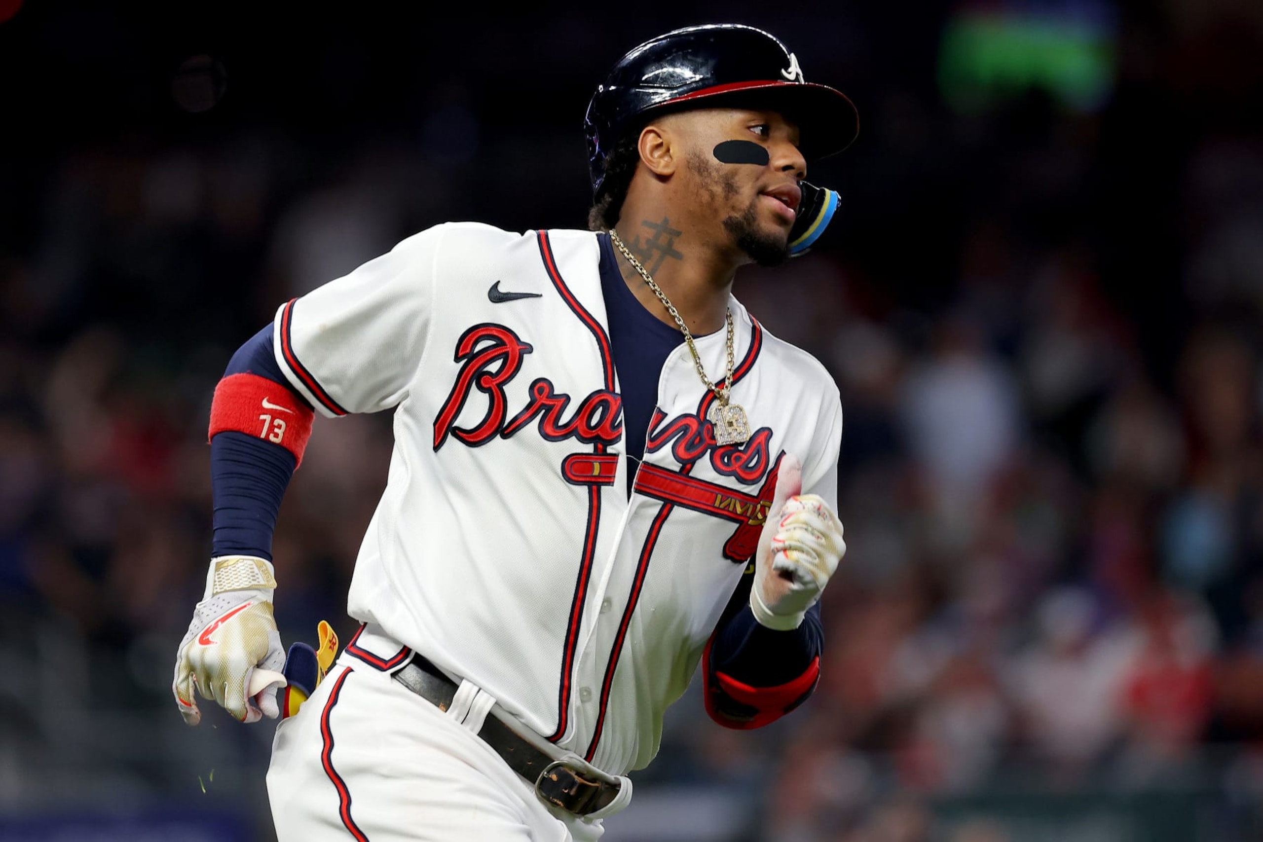 ATLANTA, GEORGIA - OCTOBER 12: Ronald Acuna Jr. #13 of the Atlanta Braves hits a single against the Philadelphia Phillies during the fourth inning in game two of the National League Division Series at Truist Park on October 12, 2022 in Atlanta, Georgia. (Photo by Kevin C. Cox/Getty Images)