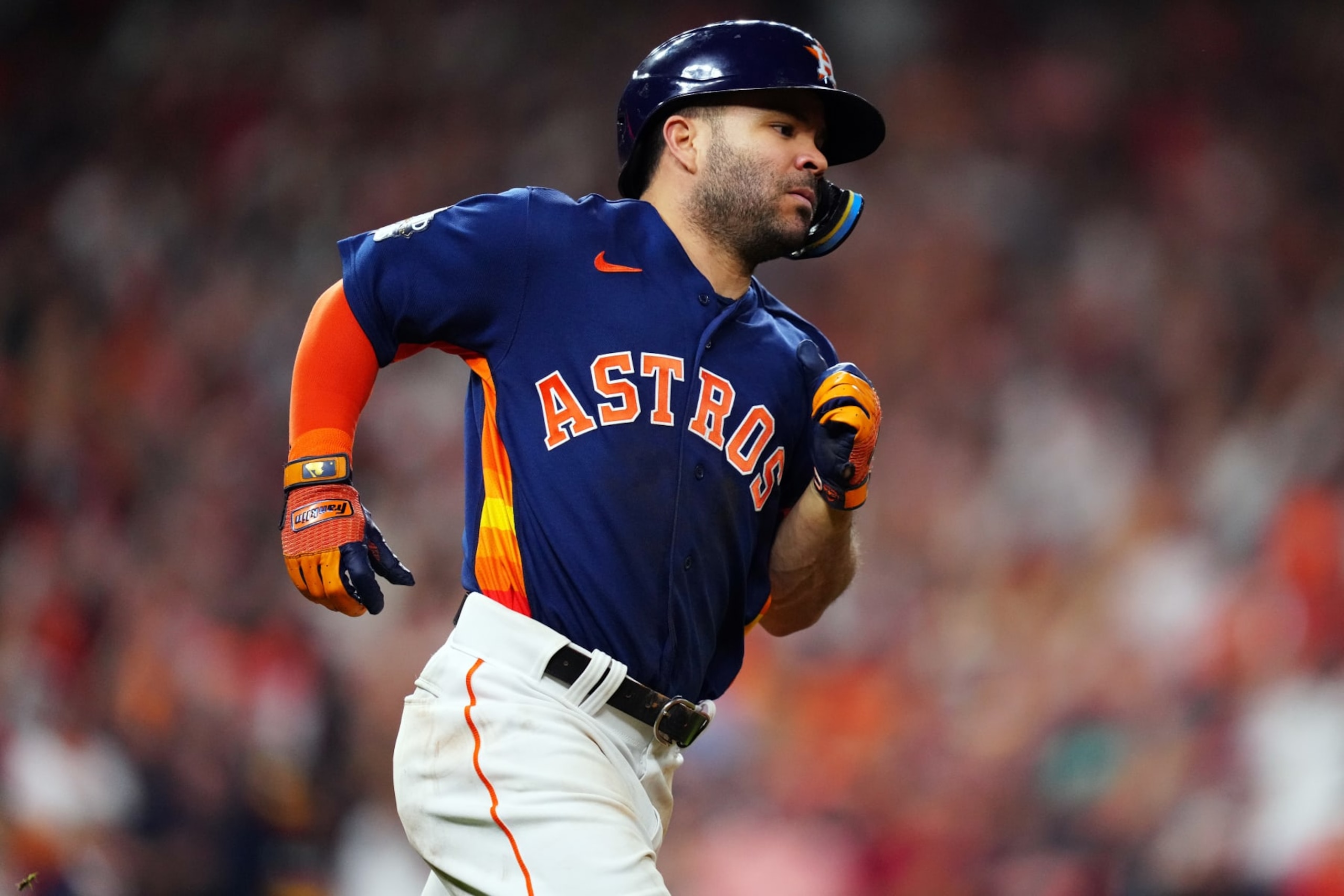 HOUSTON, TX - NOVEMBER 05:  Jose Altuve #27 of the Houston Astros runs to first base with a single in the seventh inning during Game 6 of the 2022 World Series between the Philadelphia Phillies and the Houston Astros at Minute Maid Park on Saturday, November 5, 2022 in Houston, Texas. (Photo by Daniel Shirey/MLB Photos via Getty Images)