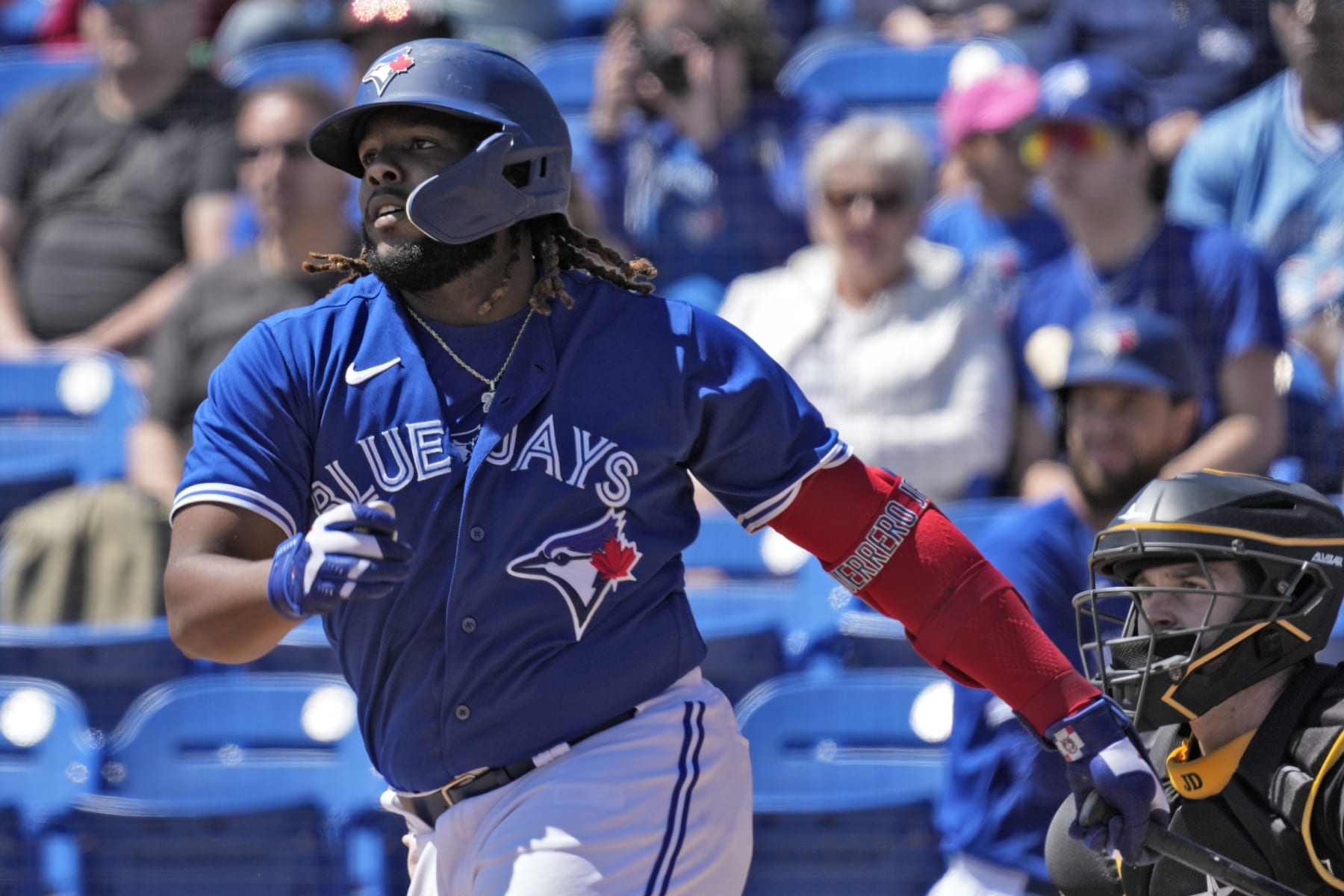 Toronto Blue Jays' Vladimir Guerrero Jr. follows through on a single off Pittsburgh Pirates pitcher JT Brubaker during the first inning of a spring training baseball game Wednesday, March 15, 2023, in Dunedin, Fla. (AP Photo/Chris O'Meara)