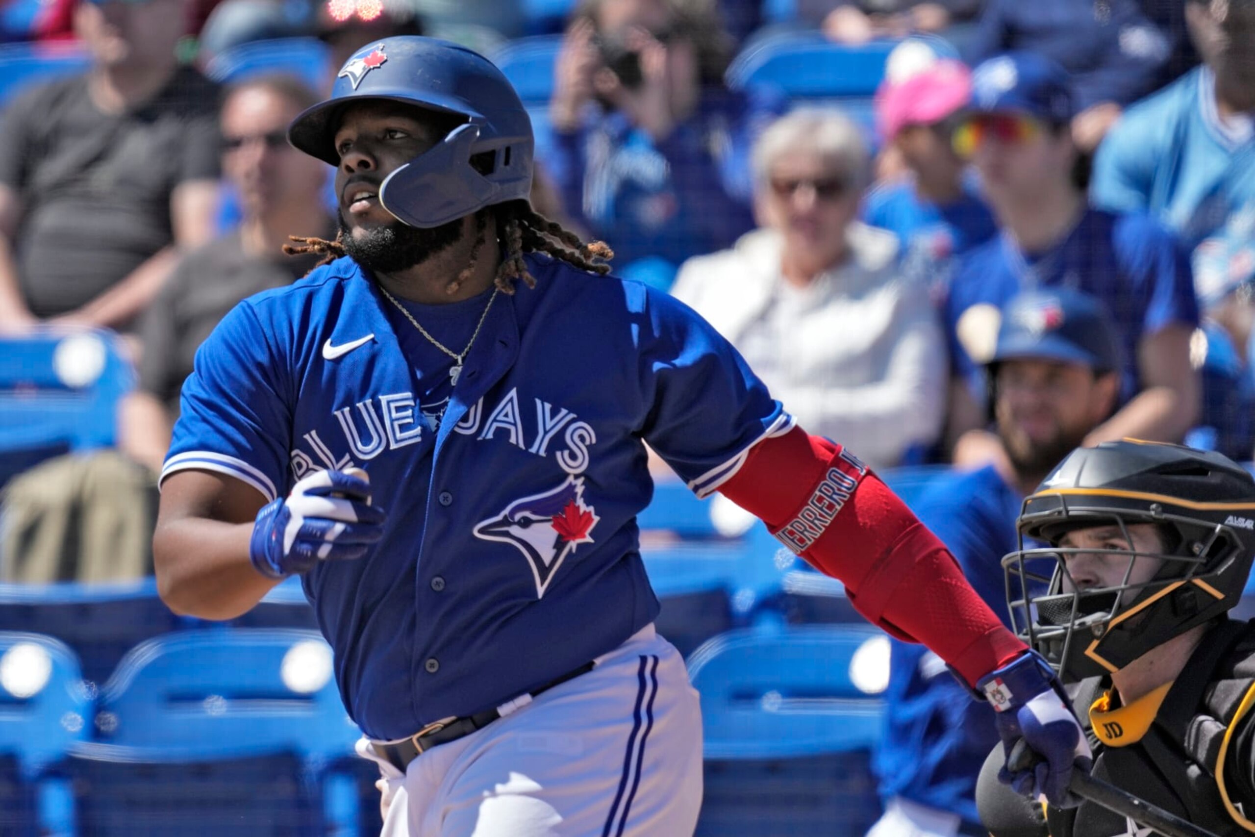 Toronto Blue Jays' Vladimir Guerrero Jr. follows through on a single off Pittsburgh Pirates pitcher JT Brubaker during the first inning of a spring training baseball game Wednesday, March 15, 2023, in Dunedin, Fla. (AP Photo/Chris O'Meara)