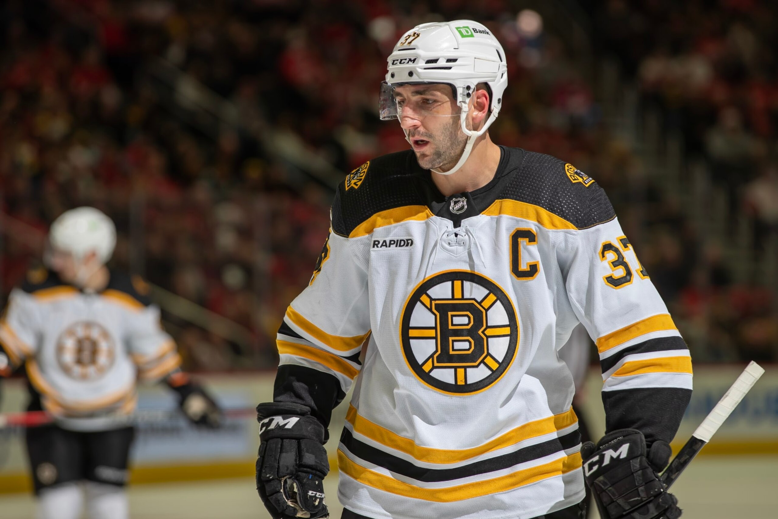 DETROIT, MI - MARCH 12: Patrice Bergeron #37 of the Boston Bruins gets set for the face-off against the Detroit Red Wings during the second period of an NHL game at Little Caesars Arena on March 12, 2023 in Detroit, Michigan. Detroit defeated Boston 5-3. (Photo by Dave Reginek/NHLI via Getty Images)