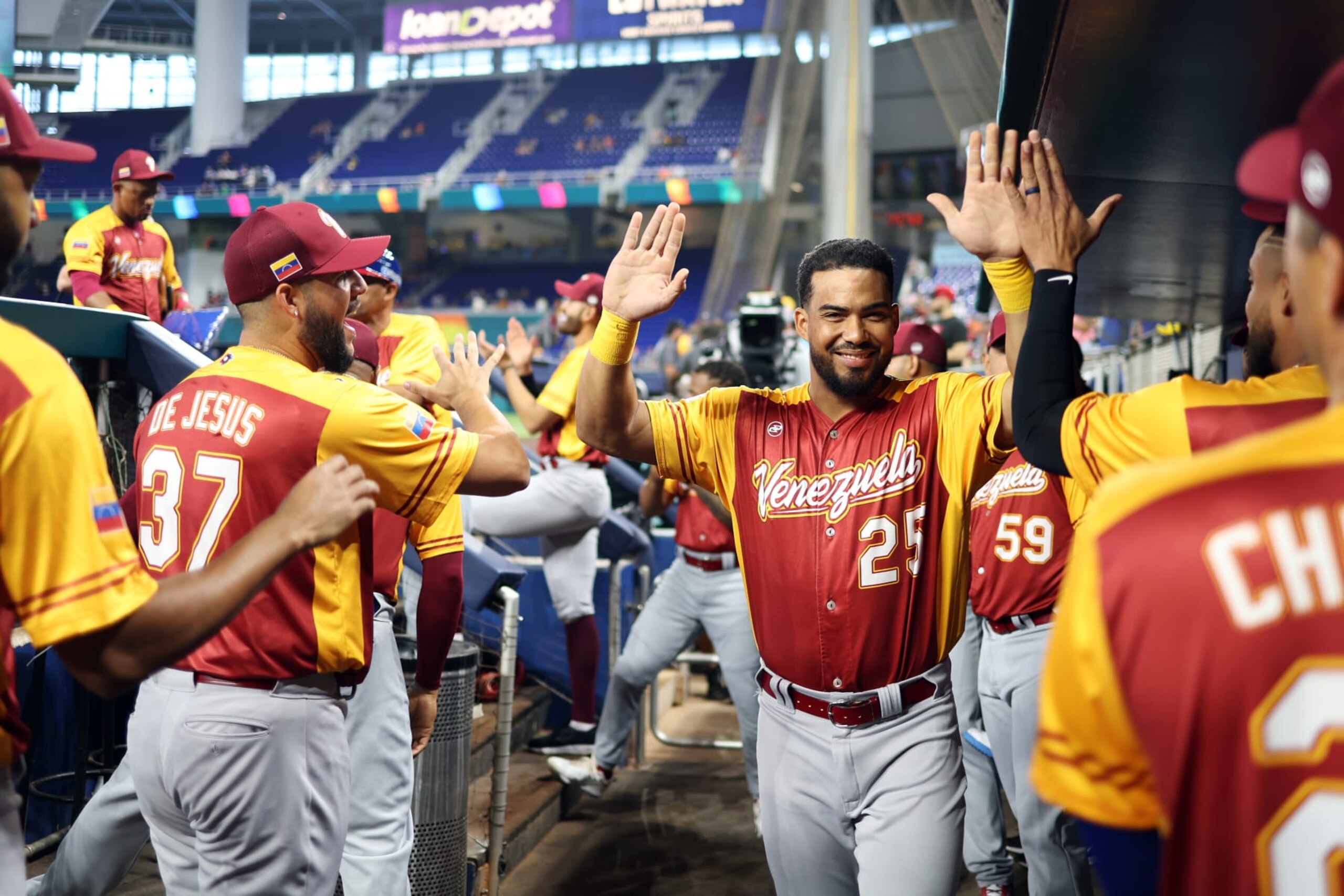 MIAMI, FL - MARCH 15:  Anthony Santander #25 of Team Venezuela greets teammates in the dugout during Game 9 of Pool D between Team Venezuela and Team Israel at loanDepot Park on Wednesday, March 15, 2023 in Miami, Florida. (Photo by Rob Tringali/WBCI/MLB Photos via Getty Images)