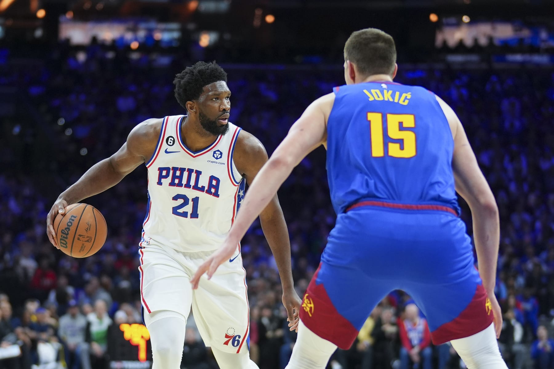 PHILADELPHIA, PA - JANUARY 28: Joel Embiid #21 of the Philadelphia 76ers dribbles the ball against Nikola Jokic #15 of the Denver Nuggets at the Wells Fargo Center on January 28, 2023 in Philadelphia, Pennsylvania. NOTE TO USER: User expressly acknowledges and agrees that, by downloading and or using this photograph, User is consenting to the terms and conditions of the Getty Images License Agreement. (Photo by Mitchell Leff/Getty Images)