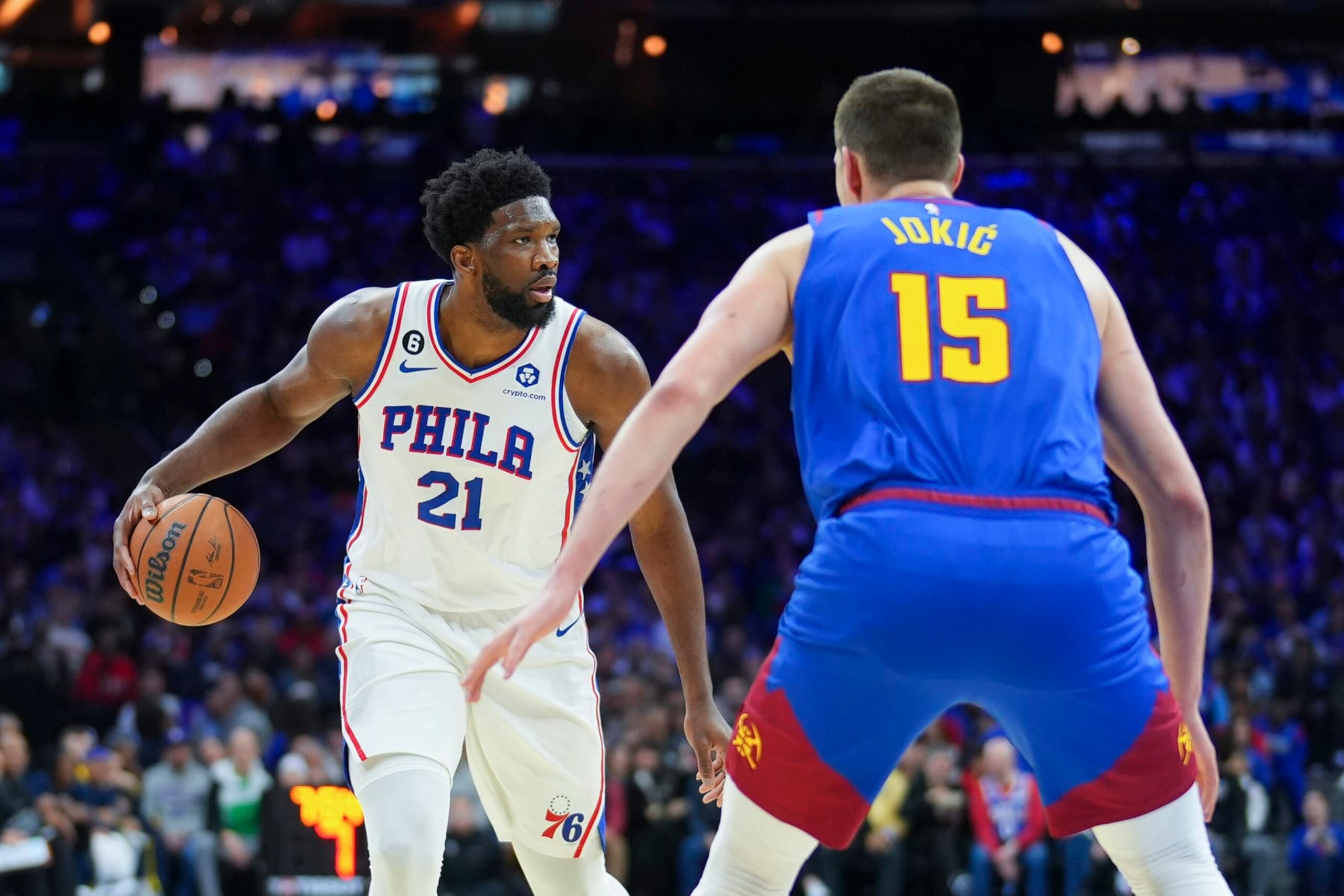 PHILADELPHIA, PA - JANUARY 28: Joel Embiid #21 of the Philadelphia 76ers dribbles the ball against Nikola Jokic #15 of the Denver Nuggets at the Wells Fargo Center on January 28, 2023 in Philadelphia, Pennsylvania. NOTE TO USER: User expressly acknowledges and agrees that, by downloading and or using this photograph, User is consenting to the terms and conditions of the Getty Images License Agreement. (Photo by Mitchell Leff/Getty Images)