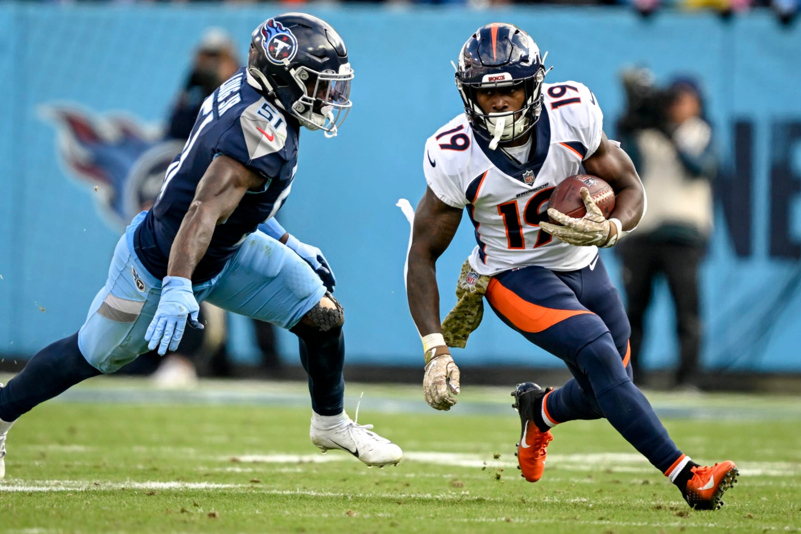 NASHVILLE, TN - NOVEMBER 13: Chase Edmonds (19) of the Denver Broncos runs as David Long Jr. (51) of the Tennessee Titans pursues during the fourth quarter of the Titans 17-10 win at Nissan Stadium in Nashville, Tennessee on Sunday, November 13, 2022. (Photo by AAron Ontiveroz/MediaNews Group/The Denver Post via Getty Images)