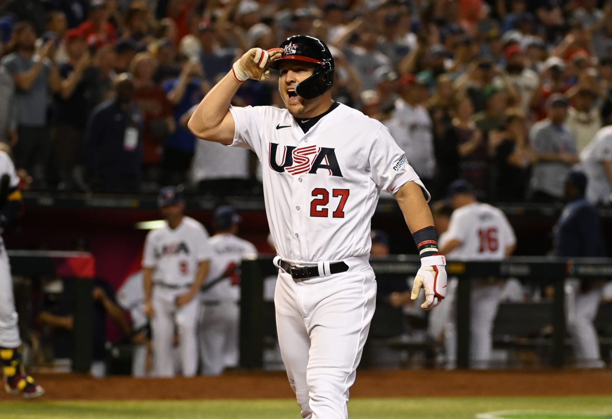 PHOENIX, ARIZONA - MARCH 13: Mike Trout #27 of the United States celebrates after hitting a home run against Canada during a World Baseball Classic Pool C game at Chase Field on March 13, 2023 in Phoenix, Arizona. (Photo by Norm Hall/Getty Images)