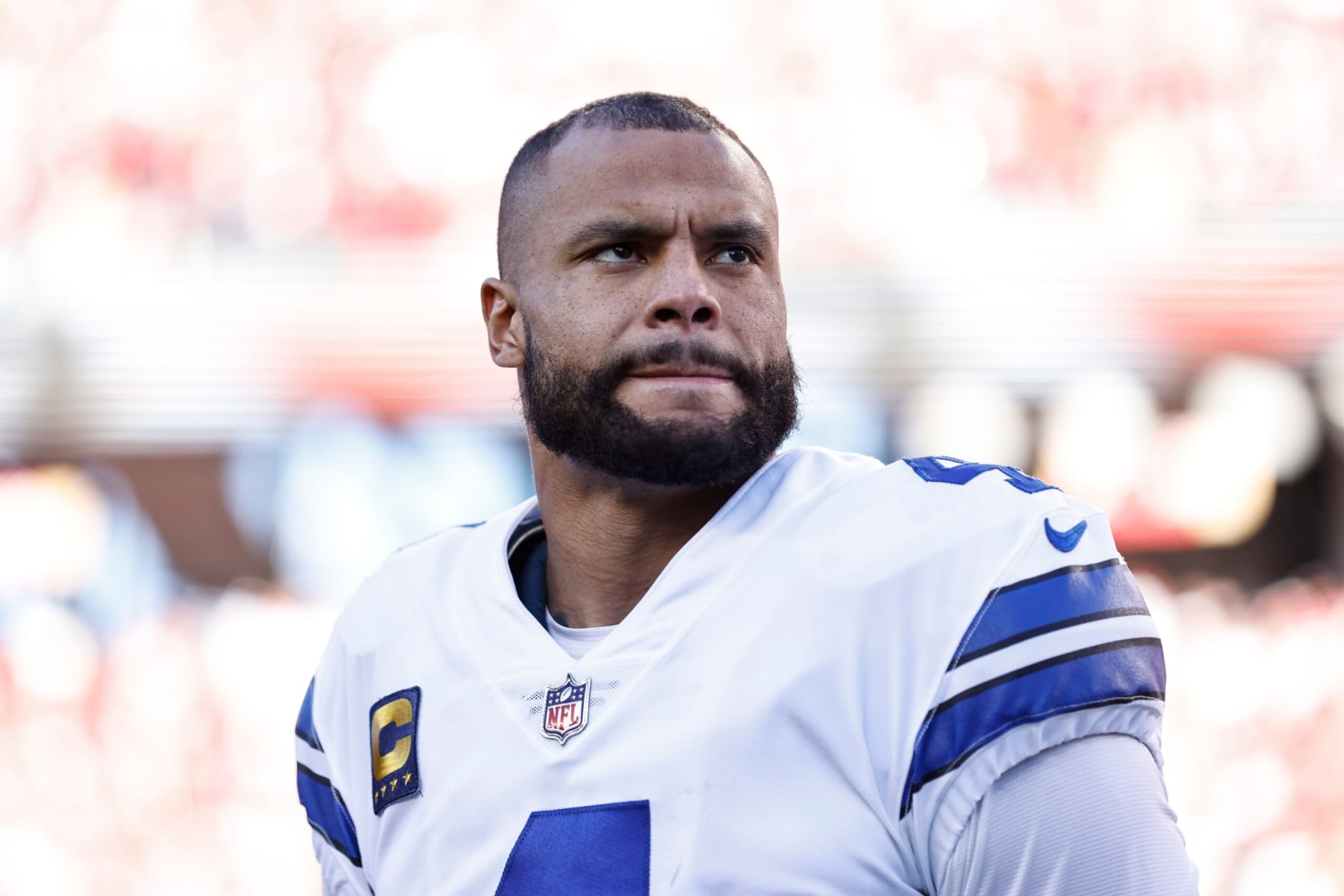 SANTA CLARA, CALIFORNIA - JANUARY 22: Dak Prescott #4 of the Dallas Cowboys looks on during the national anthem prior to an NFL divisional round playoff football game between the San Francisco 49ers and the Dallas Cowboys at Levi's Stadium on January 22, 2023 in Santa Clara, California. (Photo by Michael Owens/Getty Images)