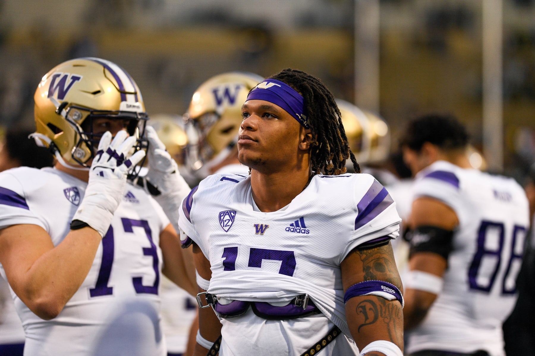 BOULDER, CO - NOVEMBER 20:  Linebacker Sav'ell Smalls #17 of the Washington Huskies looks on in the closing minutes of a game against the Colorado Buffaloes at Folsom Field on November 20, 2021 in Boulder, Colorado. (Photo by Dustin Bradford/Getty Images)