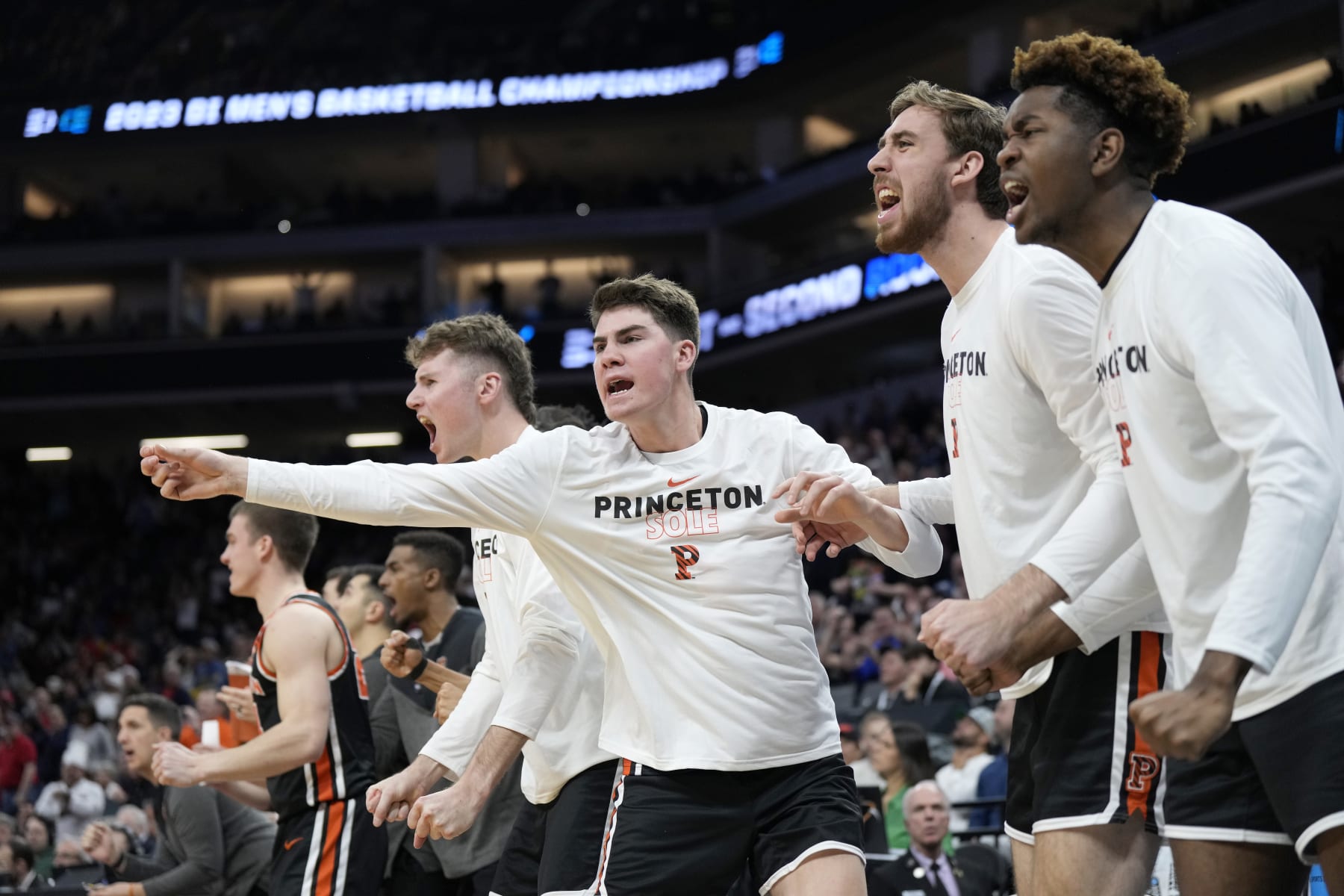 SACRAMENTO, CALIFORNIA - MARCH 16: The Princeton Tigers celebrate a basket against the Arizona Wildcats during the second half in the first round of the NCAA Men's Basketball Tournament at Golden 1 Center on March 16, 2023 in Sacramento, California. (Photo by Thearon W. Henderson/Getty Images)