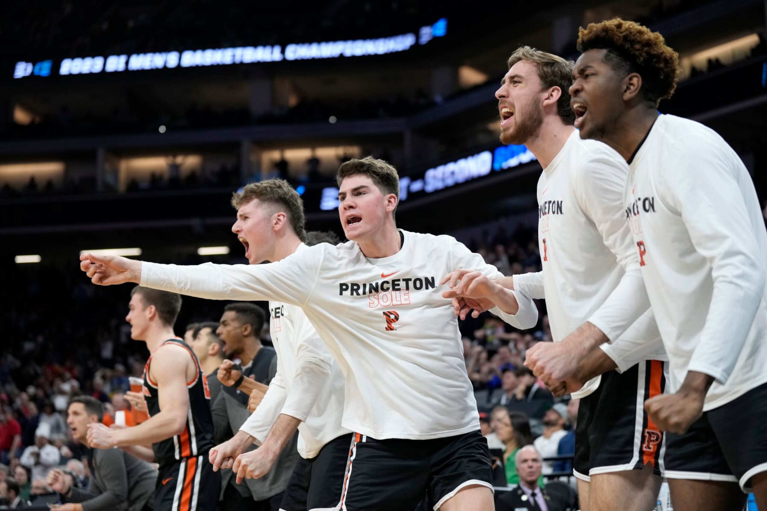SACRAMENTO, CALIFORNIA - MARCH 16: The Princeton Tigers celebrate a basket against the Arizona Wildcats during the second half in the first round of the NCAA Men's Basketball Tournament at Golden 1 Center on March 16, 2023 in Sacramento, California. (Photo by Thearon W. Henderson/Getty Images)