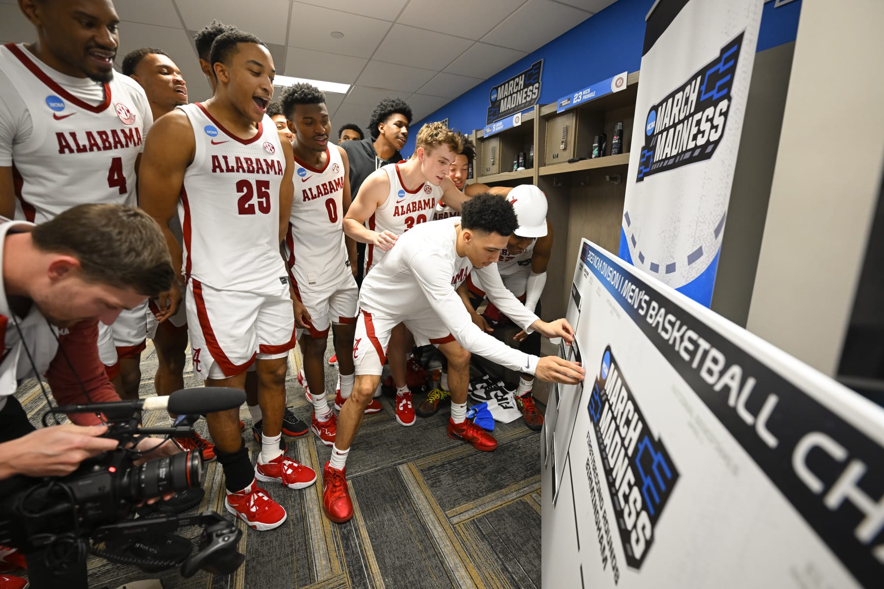 BIRMINGHAM, AL - MARCH 16: Alabama Crimson Tides celebrates and moves their name to the second round after the win against Texas A&M-Corpus Christi Islanders during the first round of the 2023 NCAA Men's Basketball Tournament held at Legacy Arena at the BJCC on March 16, 2023 in Birmingham, Alabama. (Photo by Andy Hancock/NCAA Photos via Getty Images)