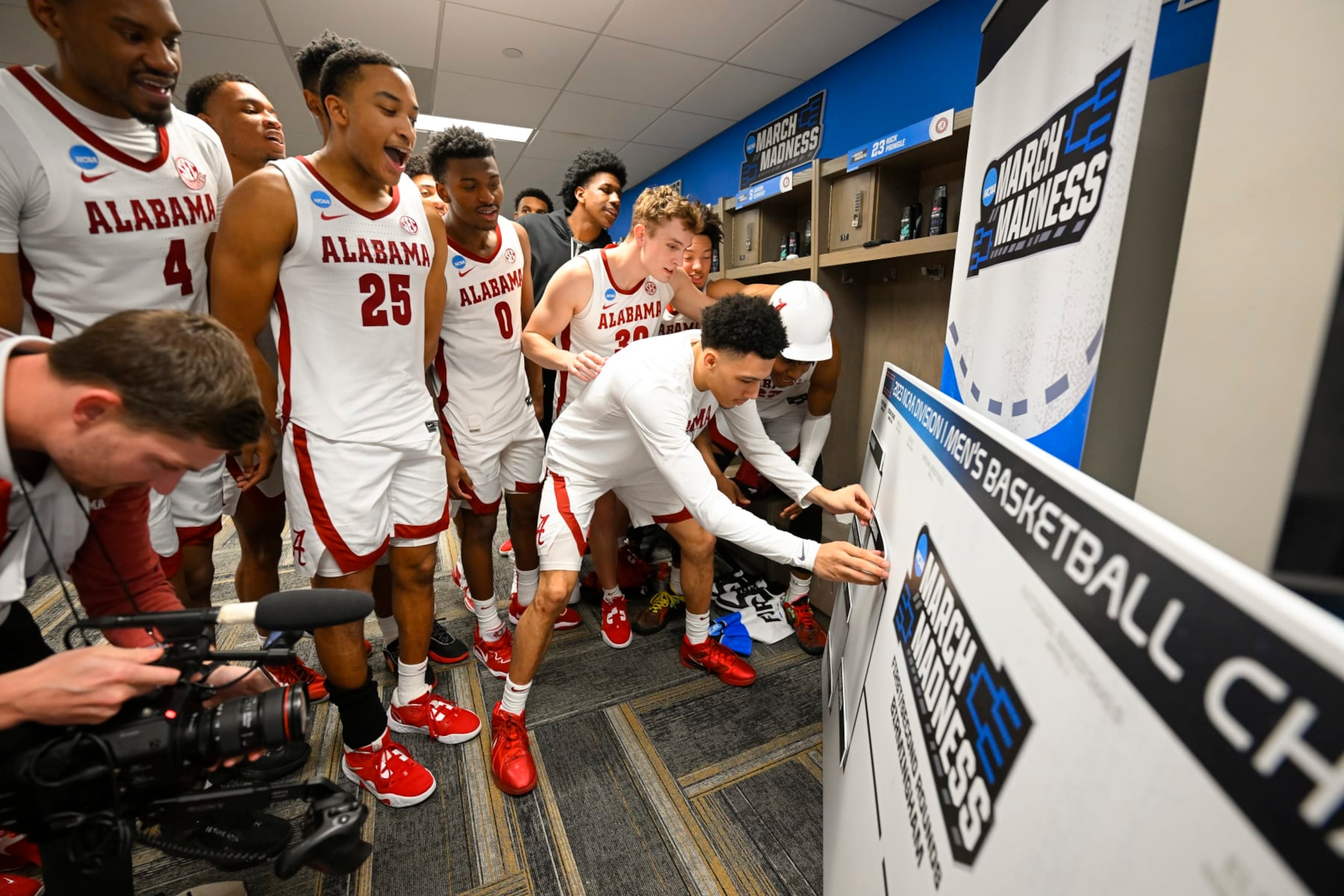 BIRMINGHAM, AL - MARCH 16: Alabama Crimson Tides celebrates and moves their name to the second round after the win against Texas A&M-Corpus Christi Islanders during the first round of the 2023 NCAA Men's Basketball Tournament held at Legacy Arena at the BJCC on March 16, 2023 in Birmingham, Alabama. (Photo by Andy Hancock/NCAA Photos via Getty Images)