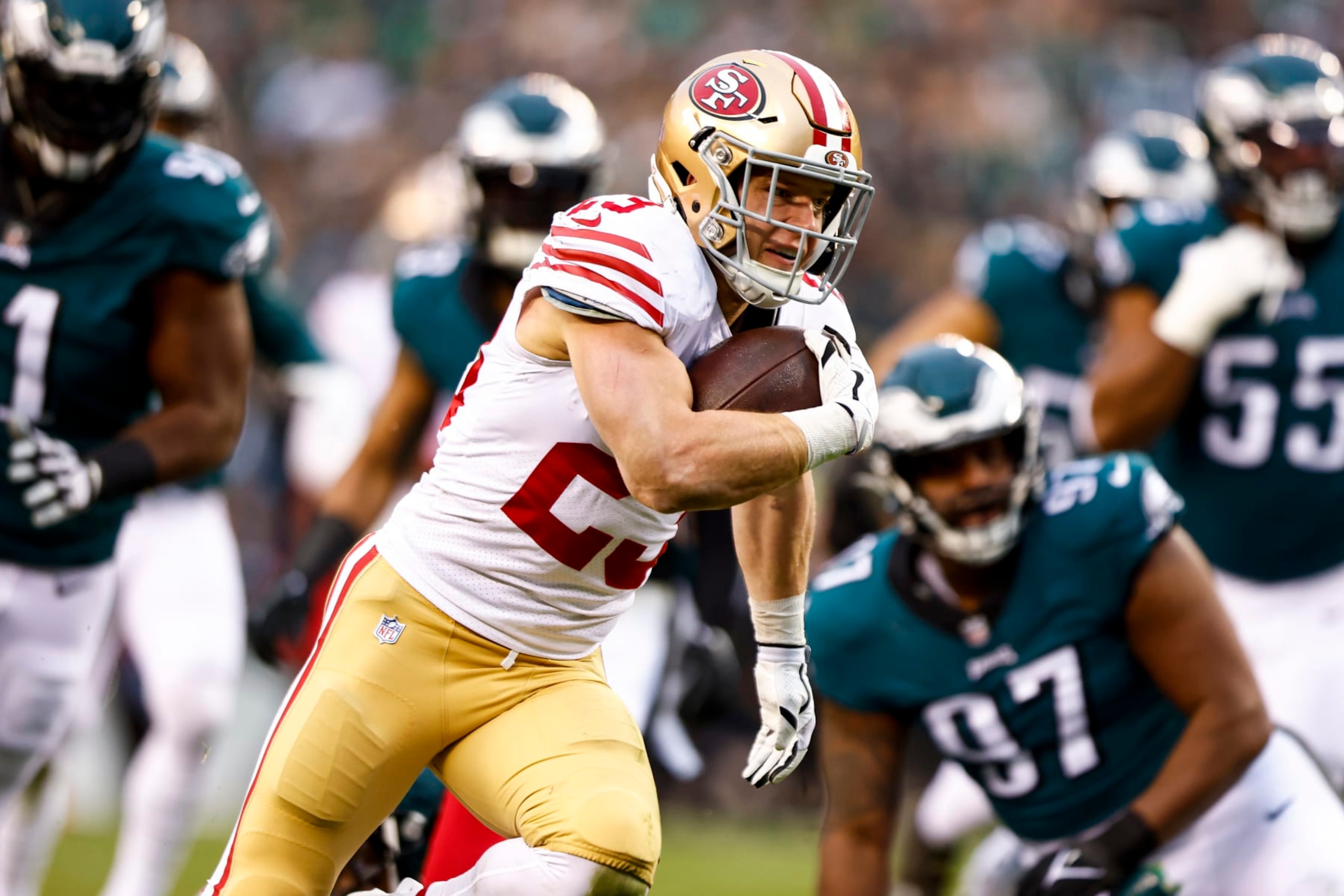 PHILADELPHIA, PA - JANUARY 29: Christian McCaffrey #23 of the San Francisco 49ers carries the ball to score a touchdown during the second quarter of the NFC Championship NFL football game against the Philadelphia Eagles at Lincoln Financial Field on January 29, 2023 in Philadelphia, Pennsylvania. (Photo by Kevin Sabitus/Getty Images)