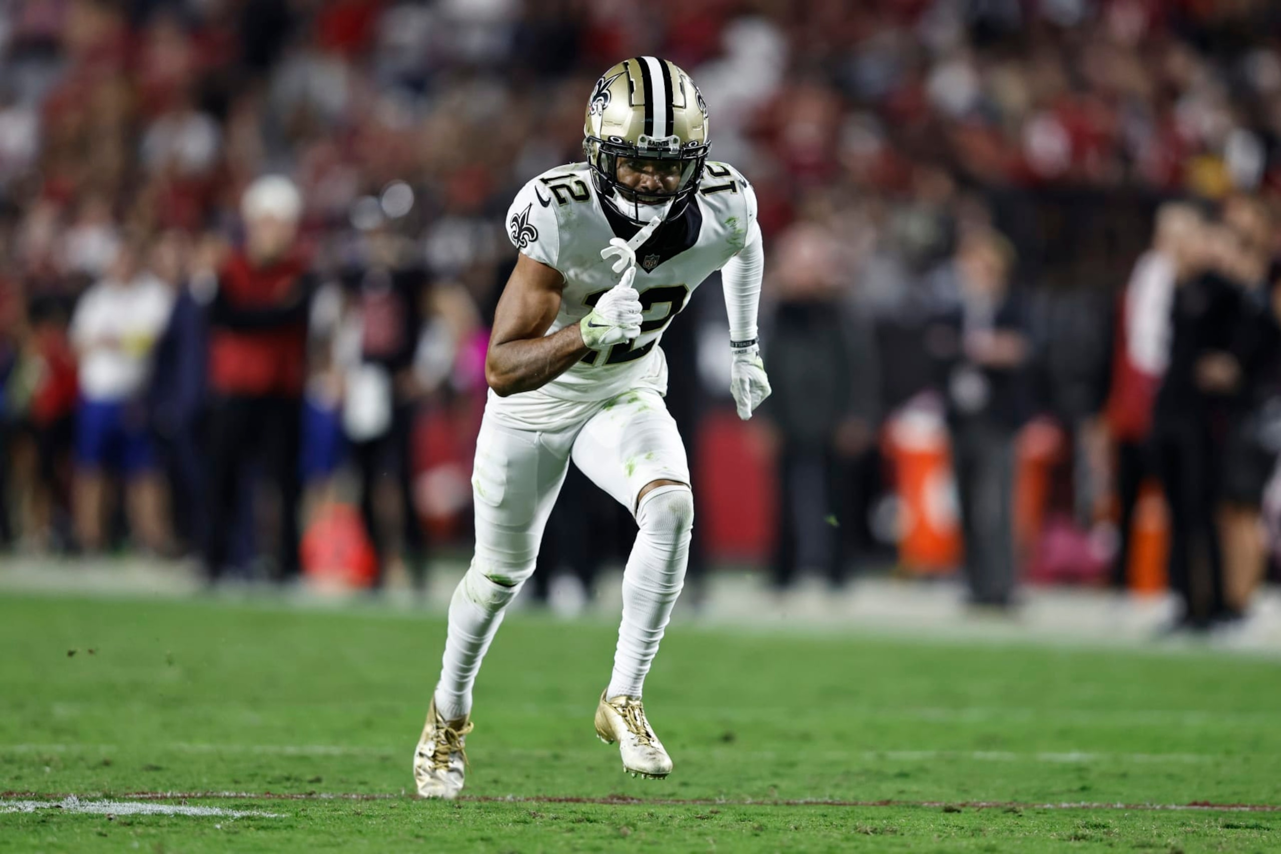 GLENDALE, ARIZONA - OCTOBER 20: Chris Olave #12 of the New Orleans Saints runs during a game between the Arizona Cardinals and the New Orleans Saints at State Farm Stadium on October 20, 2022 in Glendale, Arizona. (Photo by Michael Owens/Getty Images)