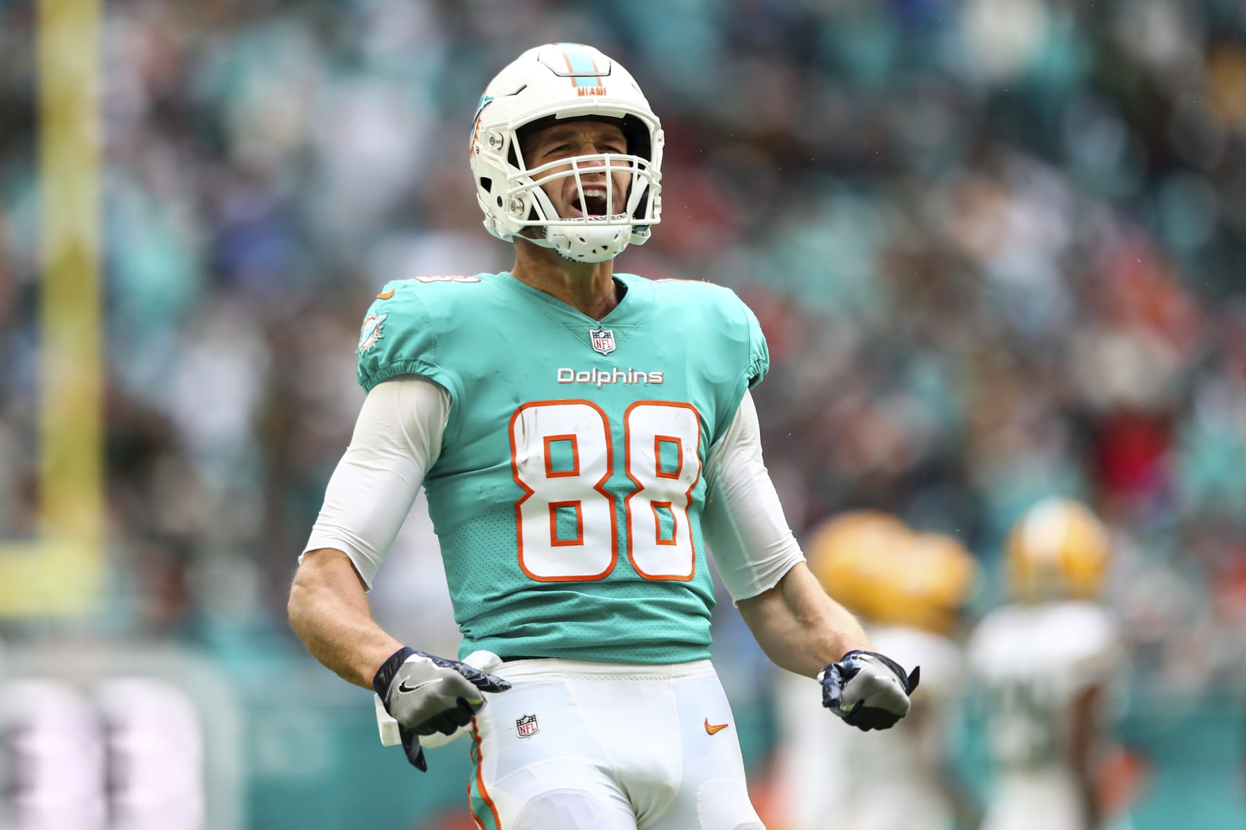 MIAMI GARDENS, FL - DECEMBER 25: Mike Gesicki #88 of the Miami Dolphins celebrates after a play during the second quarter of an NFL football game against the Green Bay Packers at Hard Rock Stadium on December 25, 2022 in Miami Gardens, Florida. (Photo by Kevin Sabitus/Getty Images)