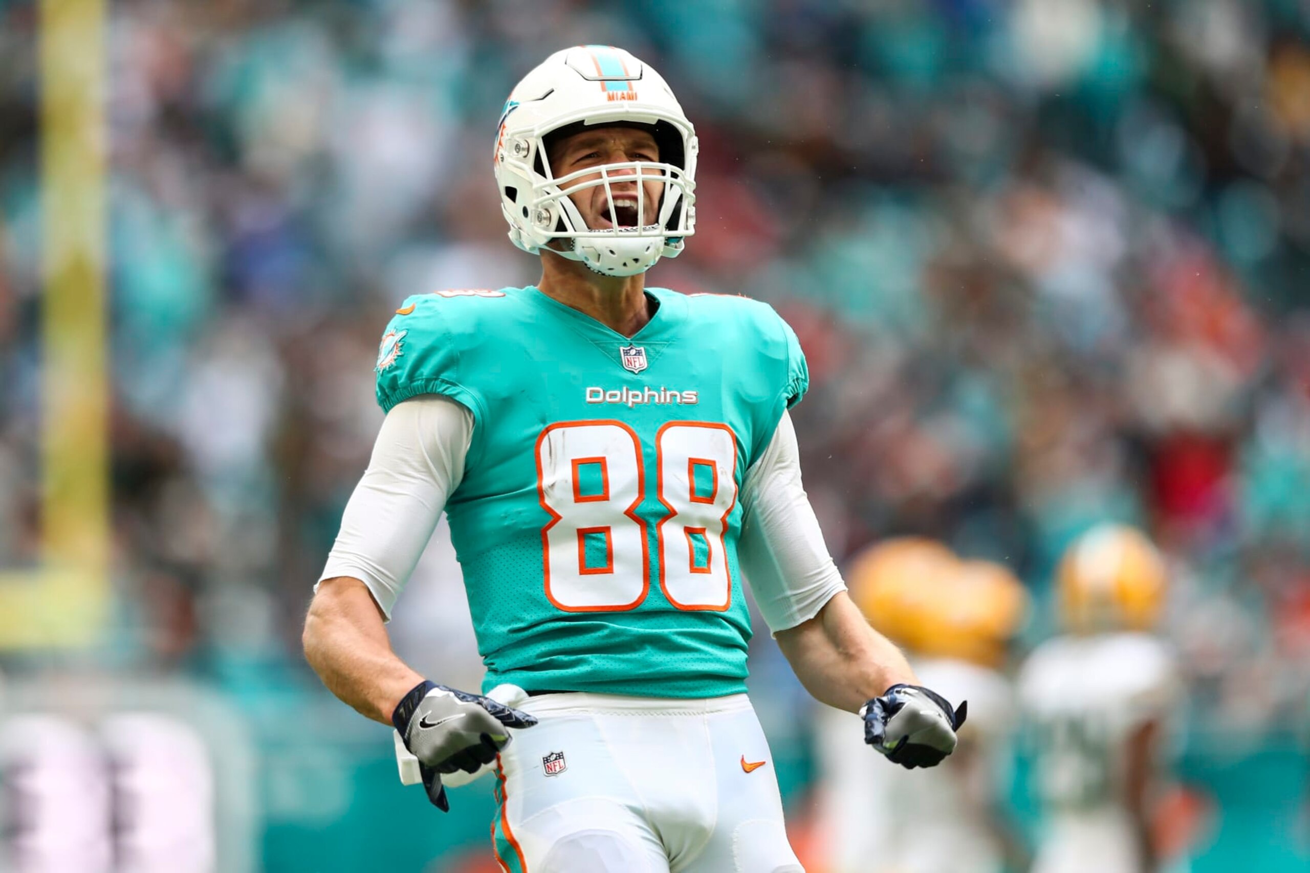 MIAMI GARDENS, FL - DECEMBER 25: Mike Gesicki #88 of the Miami Dolphins celebrates after a play during the second quarter of an NFL football game against the Green Bay Packers at Hard Rock Stadium on December 25, 2022 in Miami Gardens, Florida. (Photo by Kevin Sabitus/Getty Images)