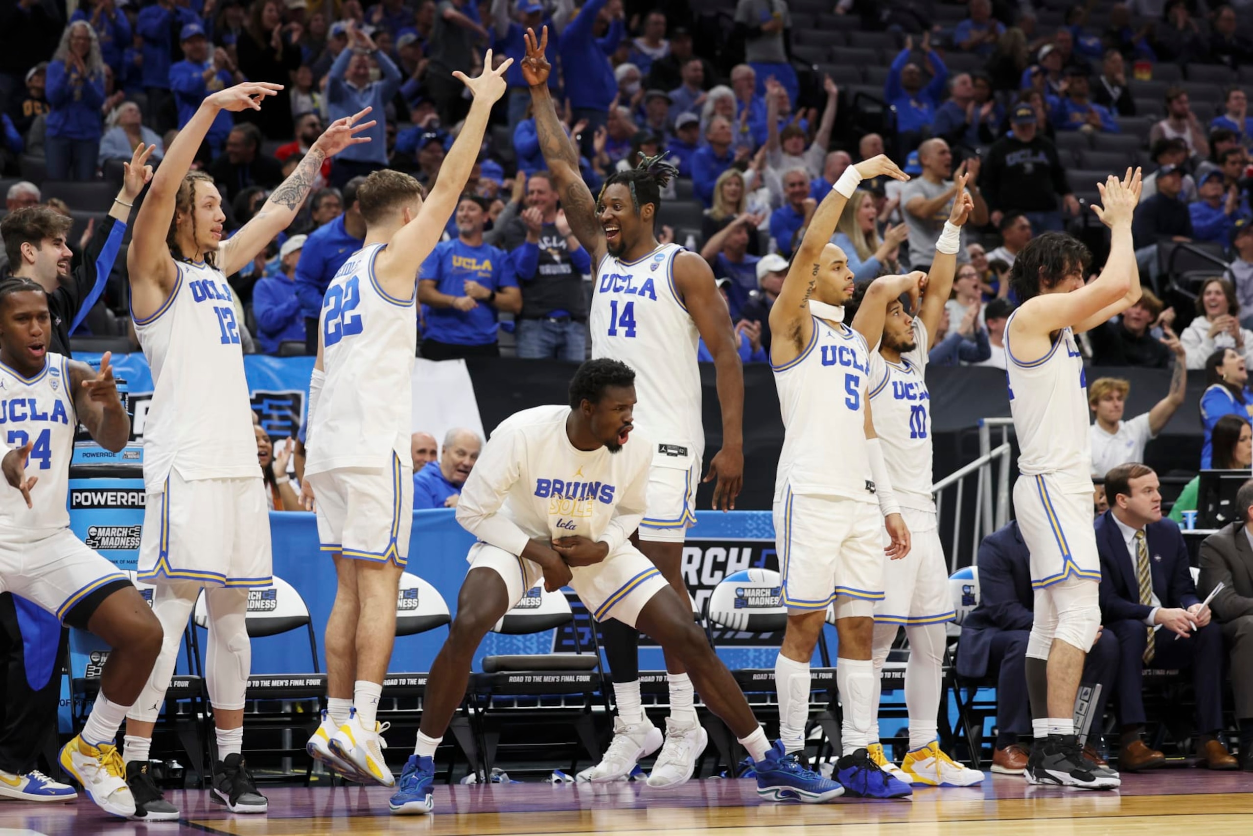 SACRAMENTO, CALIFORNIA - MARCH 16: The UCLA Bruins celebrates a three point basket during the second half of a game against the North Carolina-Asheville Bulldogs in the first round of the NCAA Men's Basketball Tournament at Golden 1 Center on March 16, 2023 in Sacramento, California. (Photo by Ezra Shaw/Getty Images) SACRAMENTO, CALIFORNIA - MARCH 16: The UCLA Bruins celebrates a three point basket during the second half of a game against the North Carolina-Asheville Bulldogs in the first round of the NCAA Men's Basketball Tournament at Golden 1 Center on March 16, 2023 in Sacramento, California. (Photo by Ezra Shaw/Getty Images)