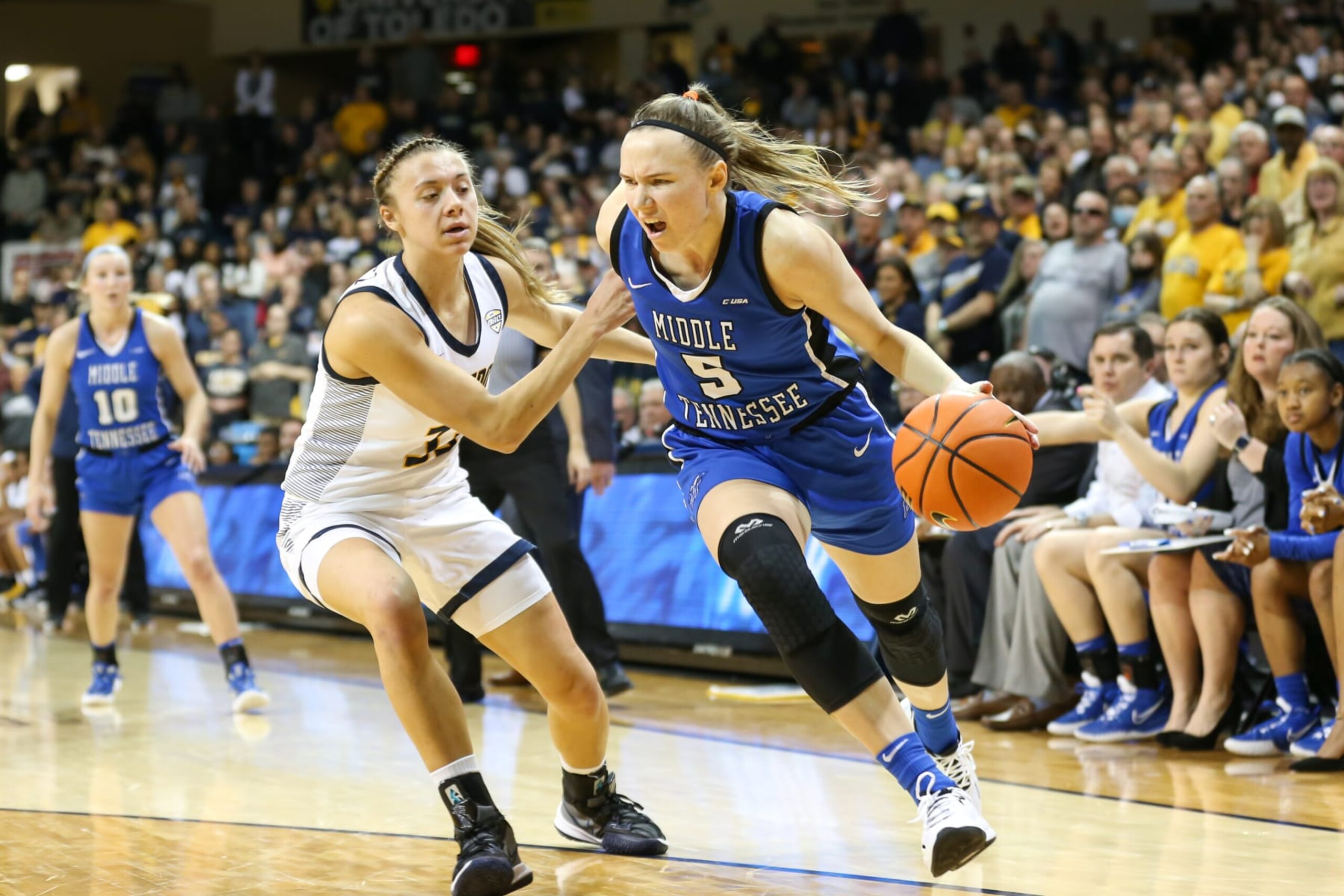 TOLEDO, OH - MARCH 28: Middle Tennessee Lady Raiders forward Kseniya Malashka (5), of Belarus, drives to the basket against Toledo Rockets guard Sammi Mikonowicz (33) during a Womens National Invitational Tournament Elite Eight basketball game between the Middle Tennessee Lady Raiders and the Toledo Rockets on March 28, 2022 at Savage Arena in Toledo, Ohio. (Photo by Scott W. Grau/Icon Sportswire via Getty Images) TOLEDO, OH - MARCH 28: Middle Tennessee Lady Raiders forward Kseniya Malashka (5), of Belarus, drives to the basket against Toledo Rockets guard Sammi Mikonowicz (33) during a Womens National Invitational Tournament Elite Eight basketball game between the Middle Tennessee Lady Raiders and the Toledo Rockets on March 28, 2022 at Savage Arena in Toledo, Ohio. (Photo by Scott W. Grau/Icon Sportswire via Getty Images)